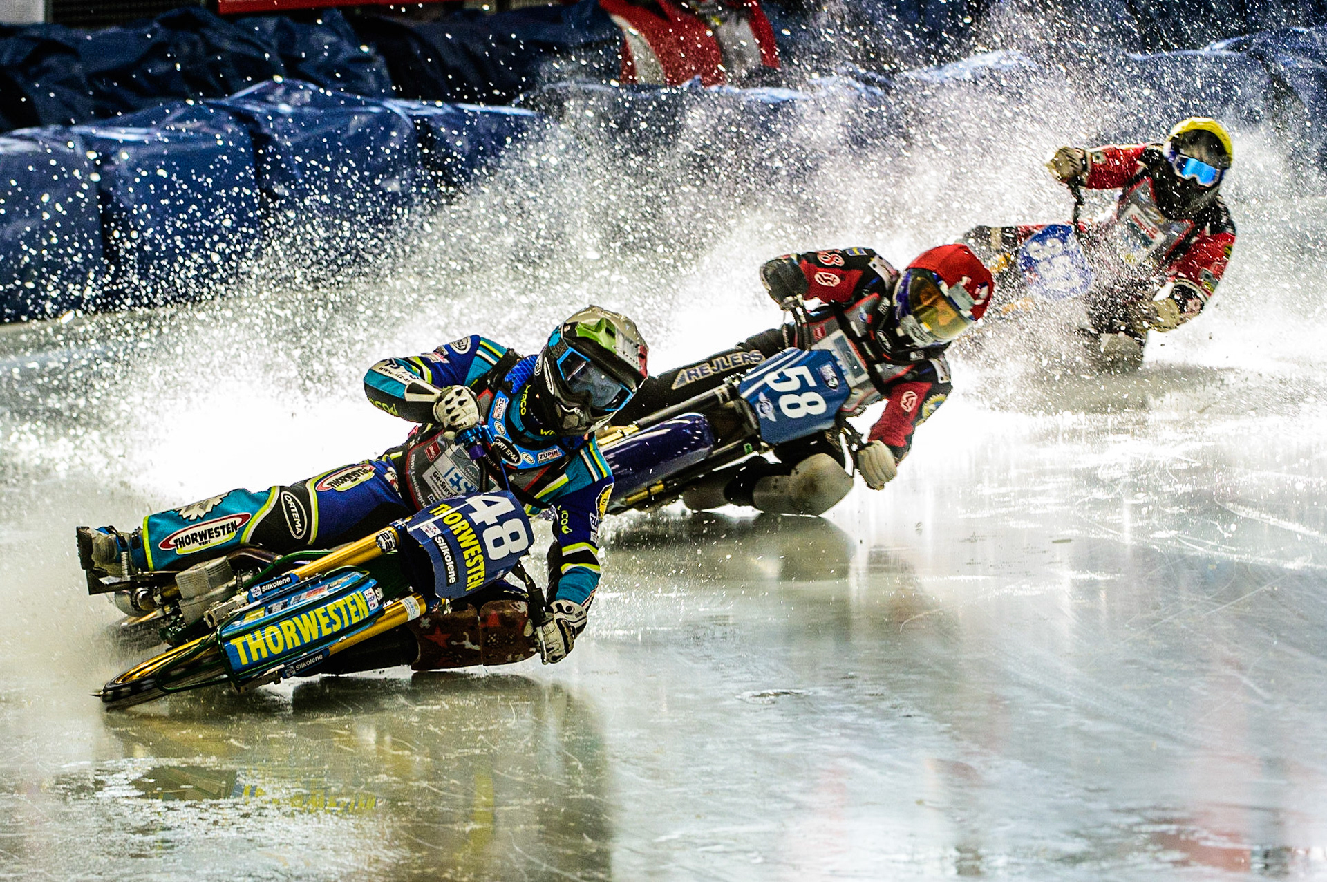 Luca Bauer (48) (White) leads Stefan Svensson (58) (Blue) and Harald Simon (50) (Yellow) during the Ice Speedway Gladiators World Championship Final 1 at Max-Aicher-Arena, Inzell, Germany on Saturday 18th March 2023. (Photo: Ian Charles | MI News)