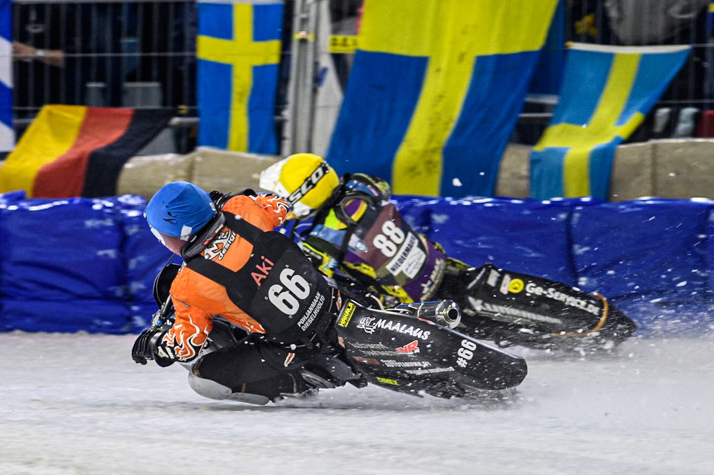Finland's Aki Ala-Riihimäki (66) in Blue chases Germany's Max Niedermaier (88) in Yellow during the FIM Ice Speedway Gladiators World Championship Final 3 at Ice Rink Thialf, Heerenveen on Saturday 6th April 2024. (Photo: Ian Charles | MI News)