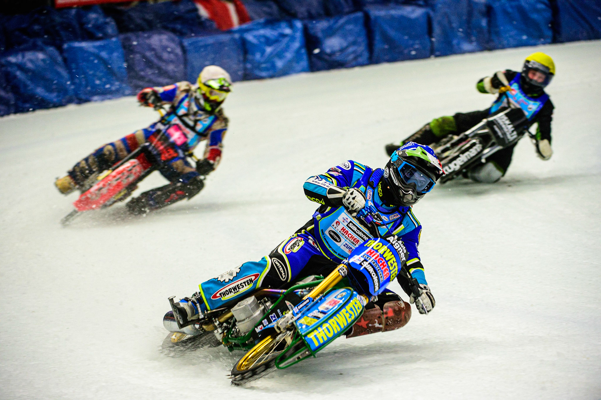 Luca Bauer (Blue) leads Jan Klatovsky (White) and Per-Olof Serenius (Yellow) during the Race of Legends at the Max-Aicher-Arena, Inzell on Friday 17th March 2023. (Photo: Ian Charles | MI News)
