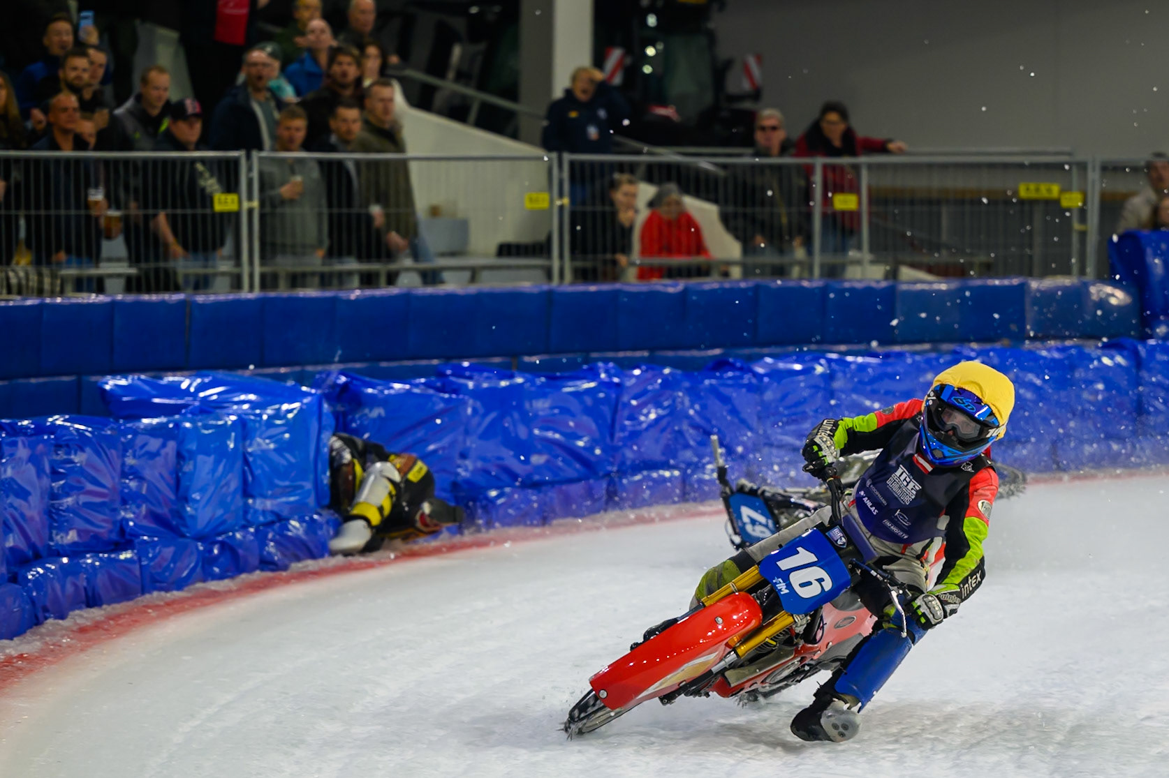 Heikki Huusko (67) of Finland  collides with Wild Card Harald Simon (16) of Austria in Yellow in the first turn during the FIM Ice Speedway Gladiators World Championship Final 3 at Ice Rink Thialf, Heerenveen on Saturday 11th April 2026. (Photo: Ian Charles | MI News)
