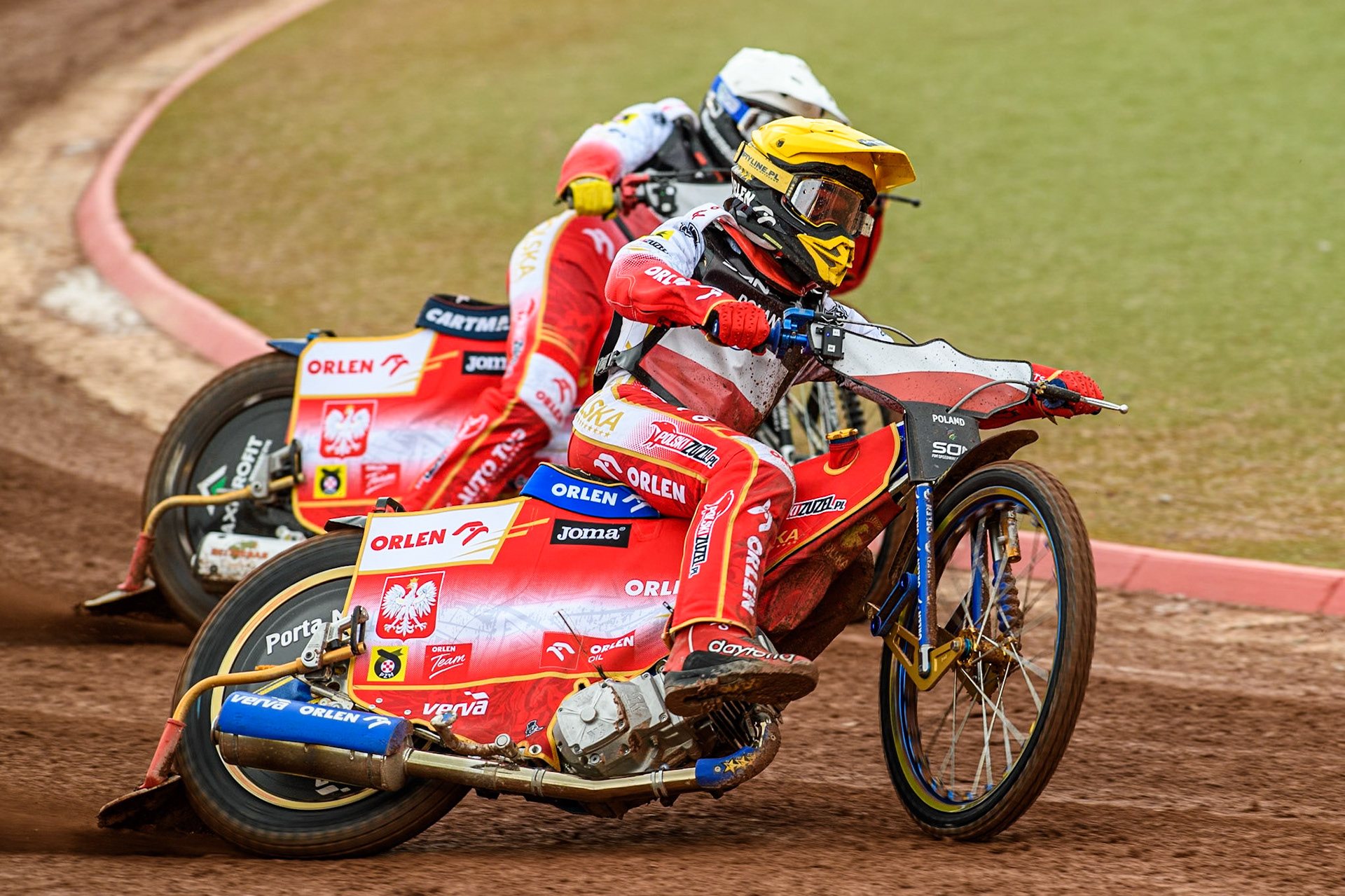 Bartosz Zmarzlik of Poland in Yellow rides outside team mate Dominik Kubera of Poland in White during the Monster Energy FIM Speedway of Nations Semi-Final 1 at the National Speedway Stadium, Manchester on Tuesday 9th July 2024. (Photo: Ian Charles | MI News)