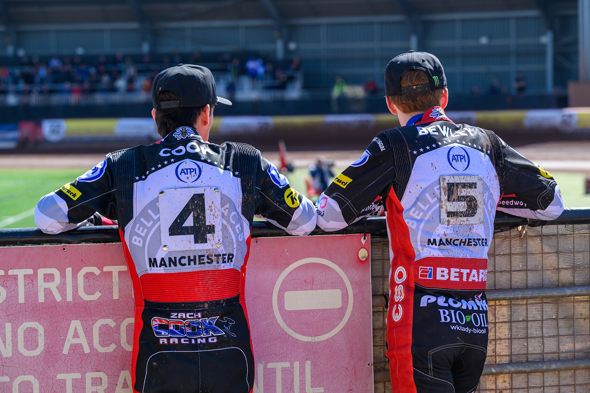 Zach Cook of Belle Vue Aces  (Left) and Dan Bewley  of Belle Vue Aces watch the track prep during the Knockout Cup Northern Section match between Belle Vue Aces and Leicester Lions at the National Speedway Stadium, Manchester on Monday 6th April 2026. (Photo: Ian Charles | MI News)