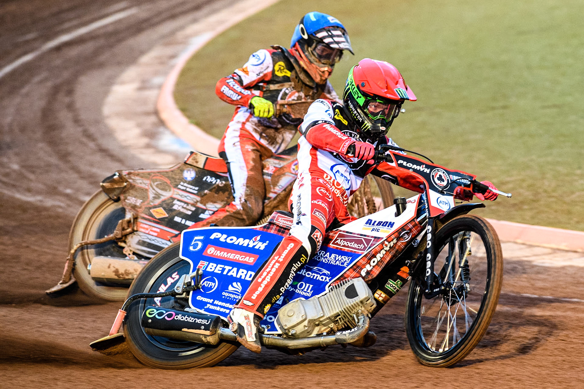 Dan Bewley of Belle Vue Aces in Red leading team mate Connor Bailey of Belle Vue Aces in Blue during the Rowe Motor Oil Premiership match between Belle Vue Aces and Leicester Lions at the National Speedway Stadium, Manchester on Saturday 6th April 2024. (Photo: Ian Charles | MI News)