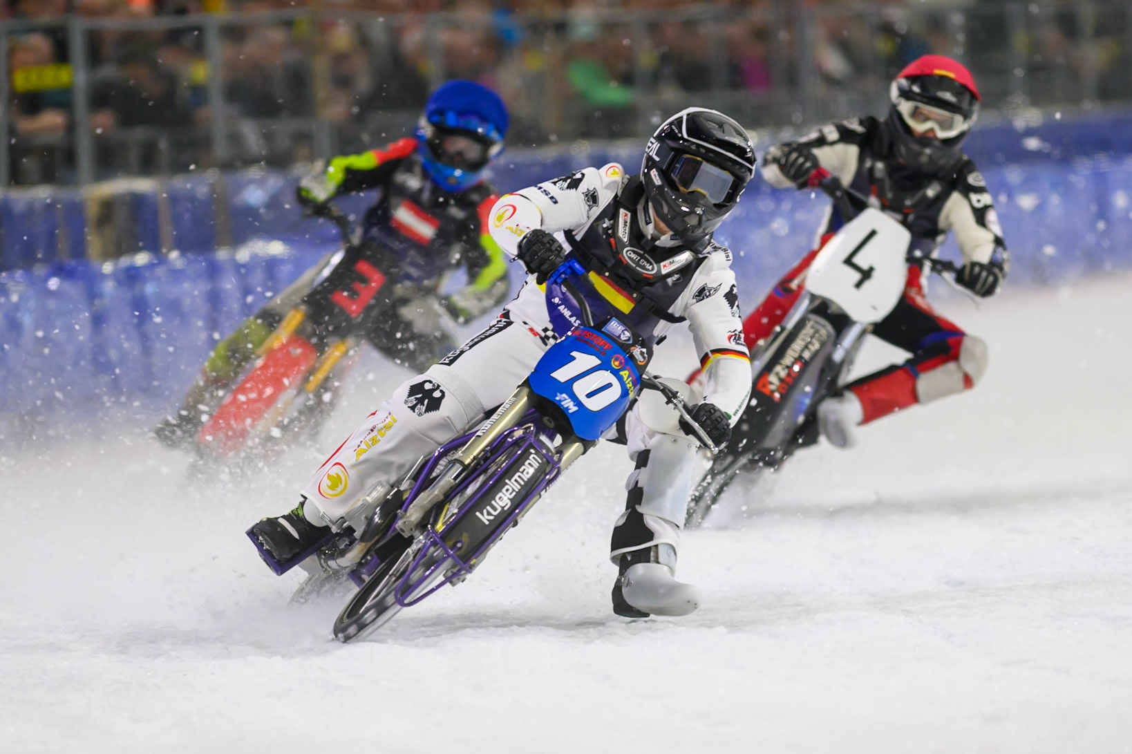 Austria v Germany: Christoph Kirchner (10) of Germany leading Martin Posch (4) of Austria  in Red and Harald Simon (3) of Austria   in Blue during the FIM Ice Speedway Of Nations at Ice Rink Thialf, Heerenveen on Sunday 12th April 2026. (Photo: Ian Charles | MI News)