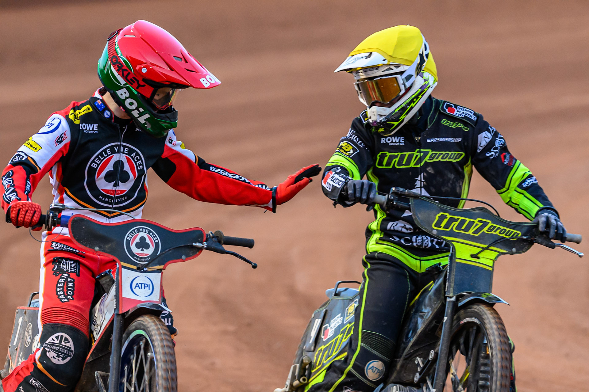 Brady Kurtz of Belle Vue Aces  (Left) with Tom Brennan of Ipswich Witches  after heat 10 during the Rowe Motor Oil Premiership match between Belle Vue Aces and Ipswich Witches at the National Speedway Stadium, Manchester on Monday 4th August 2025. (Photo: Ian Charles | MI News)