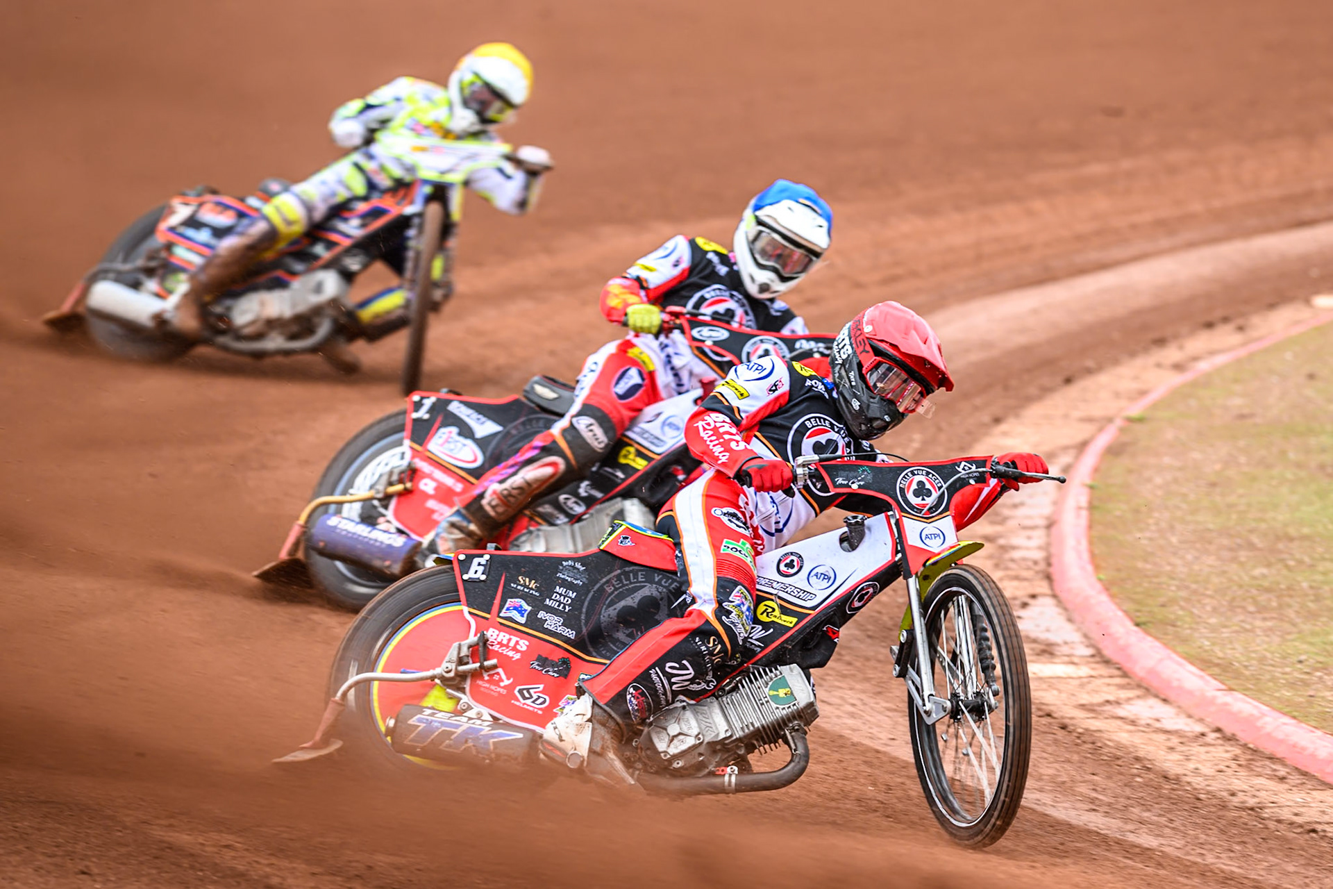 Belle Vue Aces' Tate Zischke in Red leading Belle Vue Aces' Jake Mulford in Blue and Oxford Spires' Luke Killeen in Yellow during the Rowe Motor Oil Premiership match between Belle Vue Aces and Oxford Spires at the National Speedway Stadium, Manchester on Monday 26th May 2025. (Photo: Ian Charles | MI News)