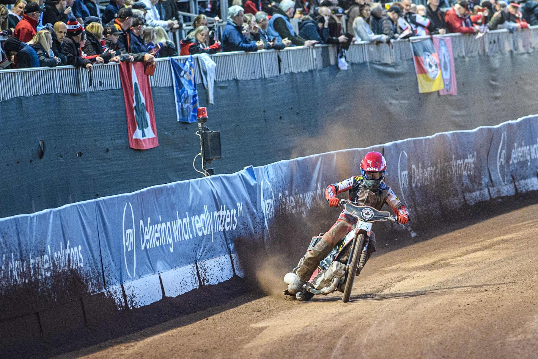 Brady Kurtz of Belle Vue Aces uses the dirt at the base of  the fence to gain speed during the Rowe Motor Oil Premiership match between Belle Vue Aces and King's Lynn Stars at the National Speedway Stadium, Manchester on Monday 5th April 2025. (Photo: Ian Charles | MI News)