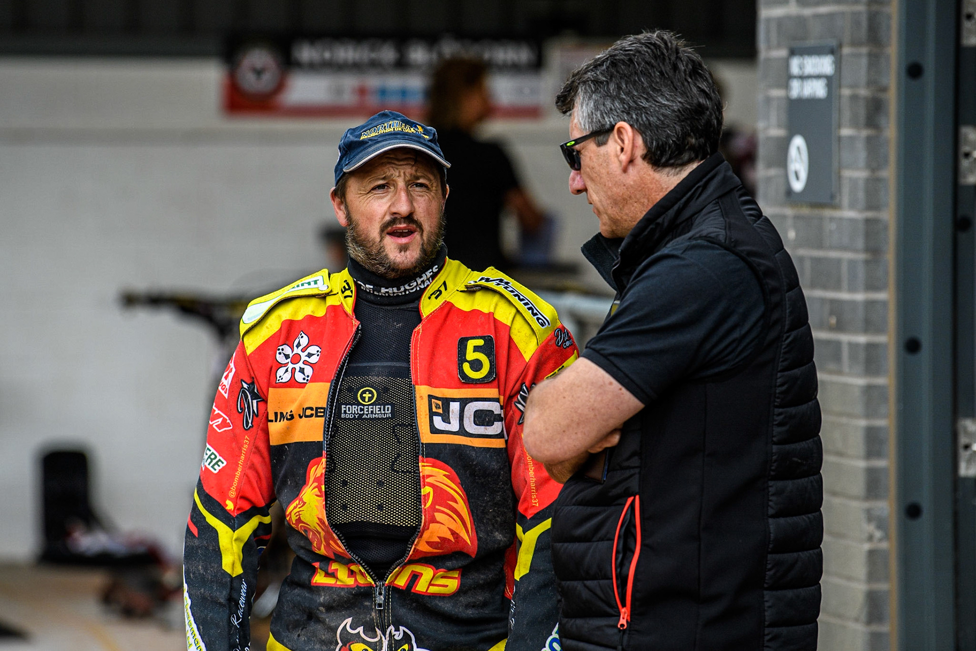 Chris Harris (Left) chats with Belle Vue ATPI Aces Team Manager Mark Lemon during the Sports Insure Premiership match between Belle Vue Aces and Leicester Lions at the National Speedway Stadium, Manchester on Monday 28th August 2023. (Photo: Ian Charles | MI News)