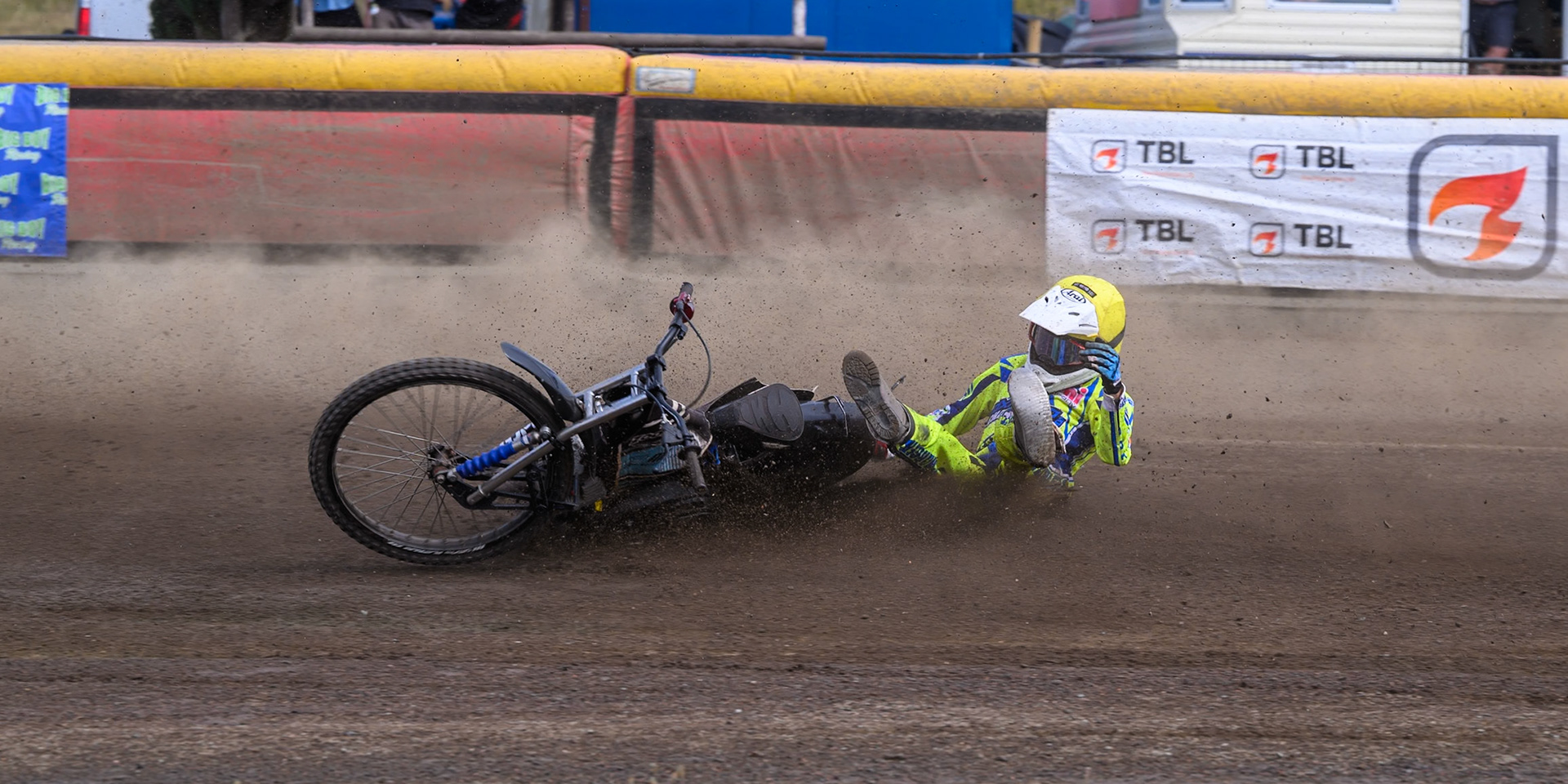 Harry Fletcher of Oxford Chargers in Yellow  falls during the WSRA National Development League match between Buxton Bulls and Oxford Chargers at Hi-Edge Speedway, Buxton on Sunday 2nd August 2026. (Photo: Ian Charles | MI News)