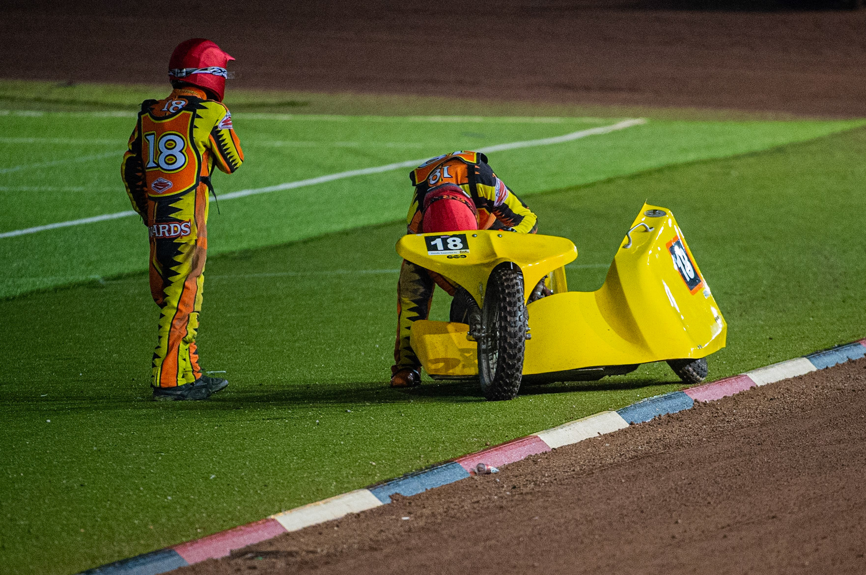 MANCHESTER, ENGLAND  Mick Stace works on the bike whilst passenger Ryan Knowles looks on during the  ACU Sidecar Speedway Manchester Masters,  Belle Vue National Speedway Stadium, Manchester Saturday 12 October 2019 (Credit: Ian Charles | MI News)