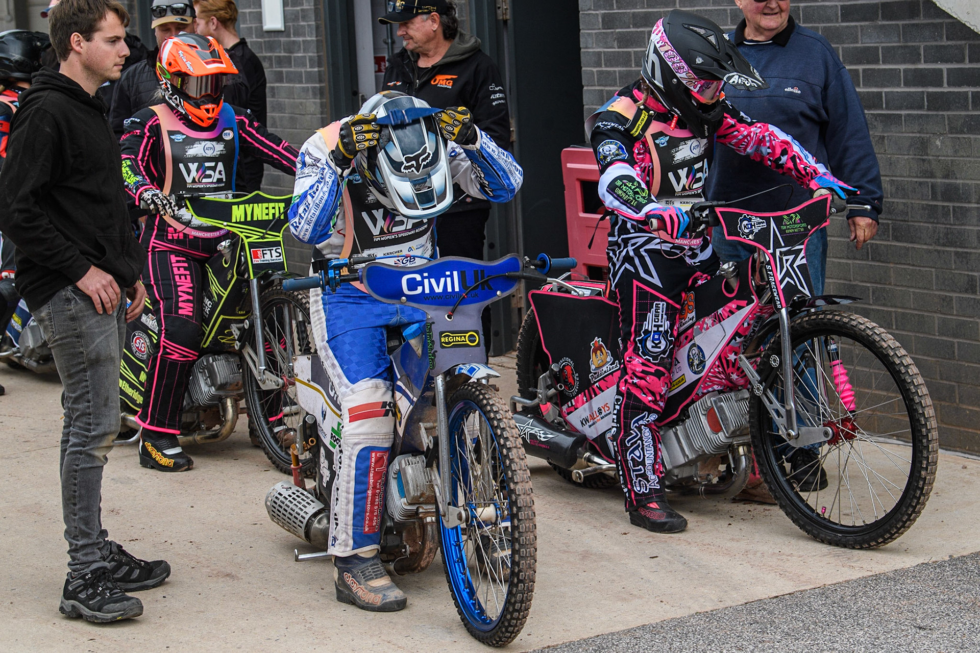 Wendy McAllan (left) and Rachel Hellowell get ready for their next rides during the FIM Women's  Speedway Academy at the National Speedway Stadium, Manchester on Friday 4th August 2023. (Photo: Ian Charles | MI News)
