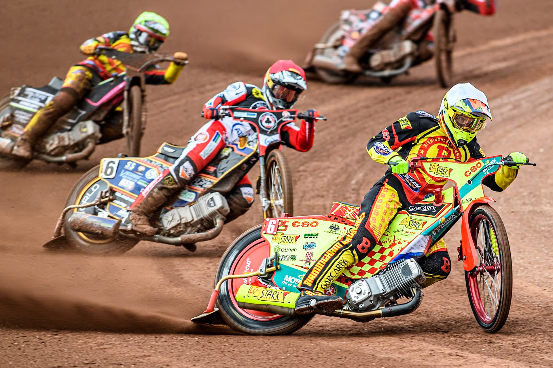 Birmingham Brummies' Vaclav Milik  in White leading Belle Vue Aces' Connor Mountain  in Red and Birmingham Brummies' Leon Flint  in Yellow during the Rowe Motor Oil Premiership match between Belle Vue Aces and Birmingham Brummies at the National Speedway Stadium, Manchester on Monday 6th May 2024. (Photo: Ian Charles | MI News)