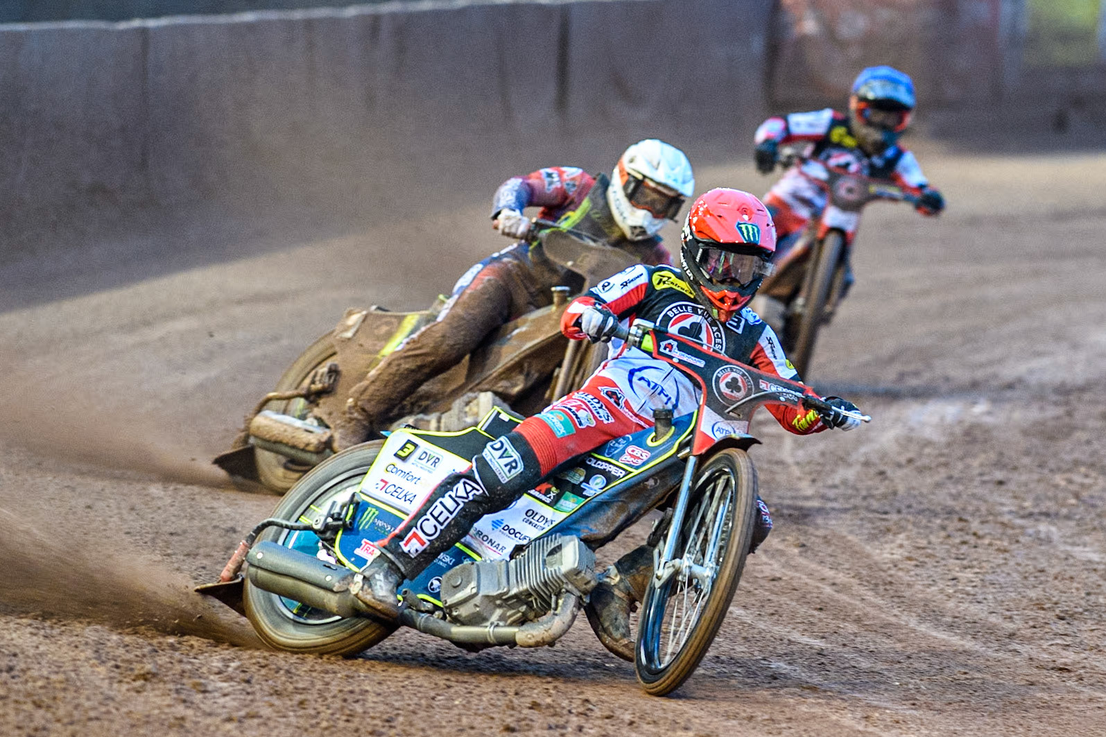 Belle Vue Aces' Jaimon Lidsey in Red leading Ipswich Witches' Emil Sayfutdinov in White and Belle Vue Aces' Ben Cook in Blue during the Rowe Motor Oil Premiership match between Belle Vue Aces and Ipswich Witches at the National Speedway Stadium, Manchester on Monday 22nd April 2024. (Photo: Ian Charles | MI News)