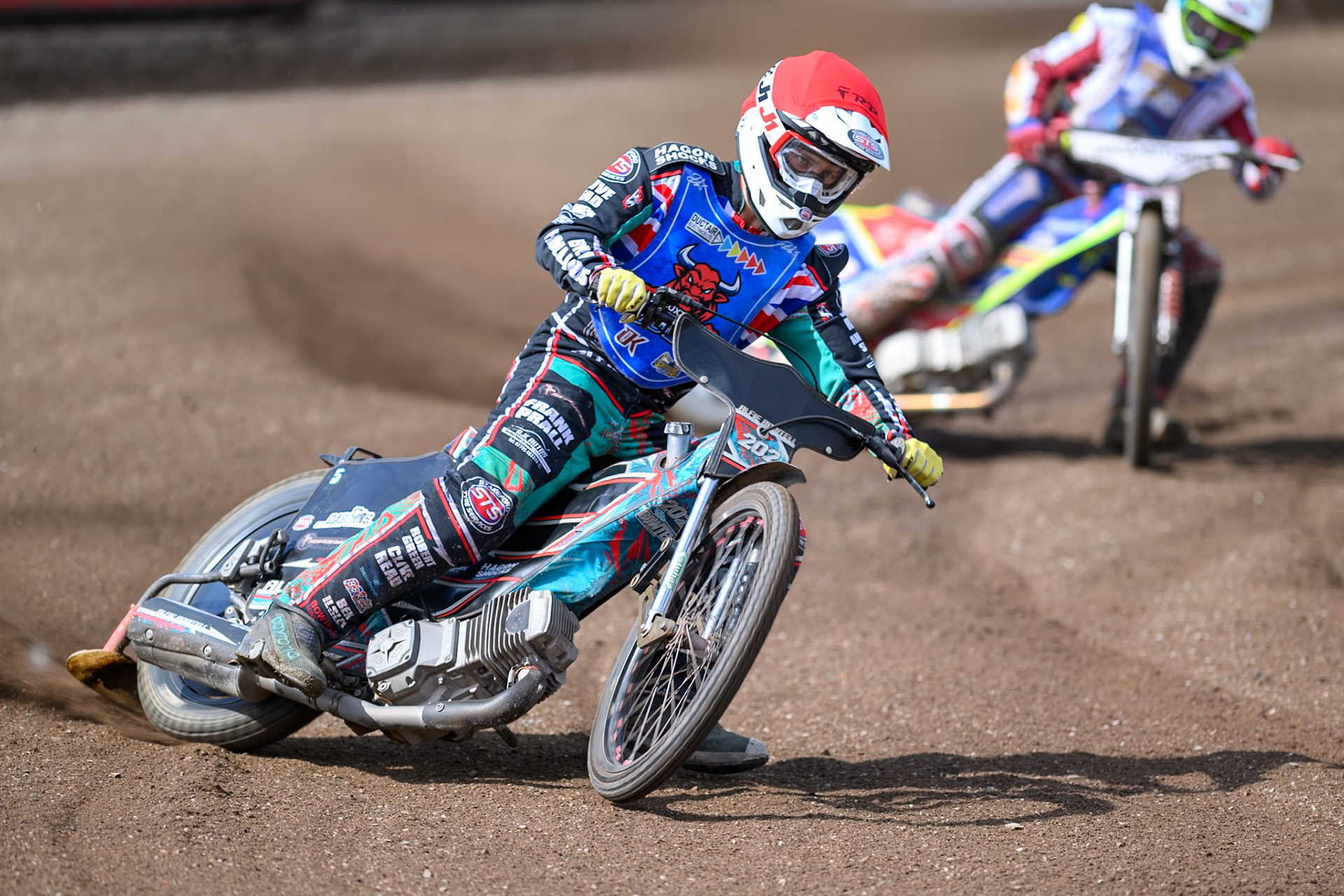 Alfie Bowtell of Buxton Bulls in Red leading Jake Mulford of Kings Lynn Young Stars in White during the WSRA National Development League match between Buxton Bulls and King's Lynn Young Stars at Hi-Edge Speedway, Buxton on Sunday 9th August 2026. (Photo: Ian Charles | MI News)