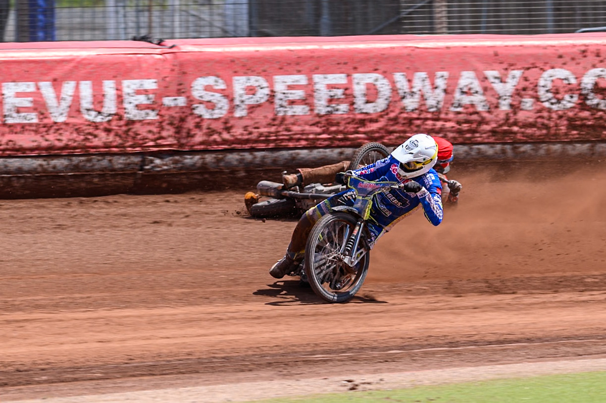 Belle Vue Colts' Jack Kingston  in Red falls as Oxford Chargers' Jody Scott  in White passes him during the WSRA National Development League match between Belle Vue Colts and Oxford Chargers at the National Speedway Stadium, Manchester on Sunday 1st June 2025. (Photo: Ian Charles | MI News)
