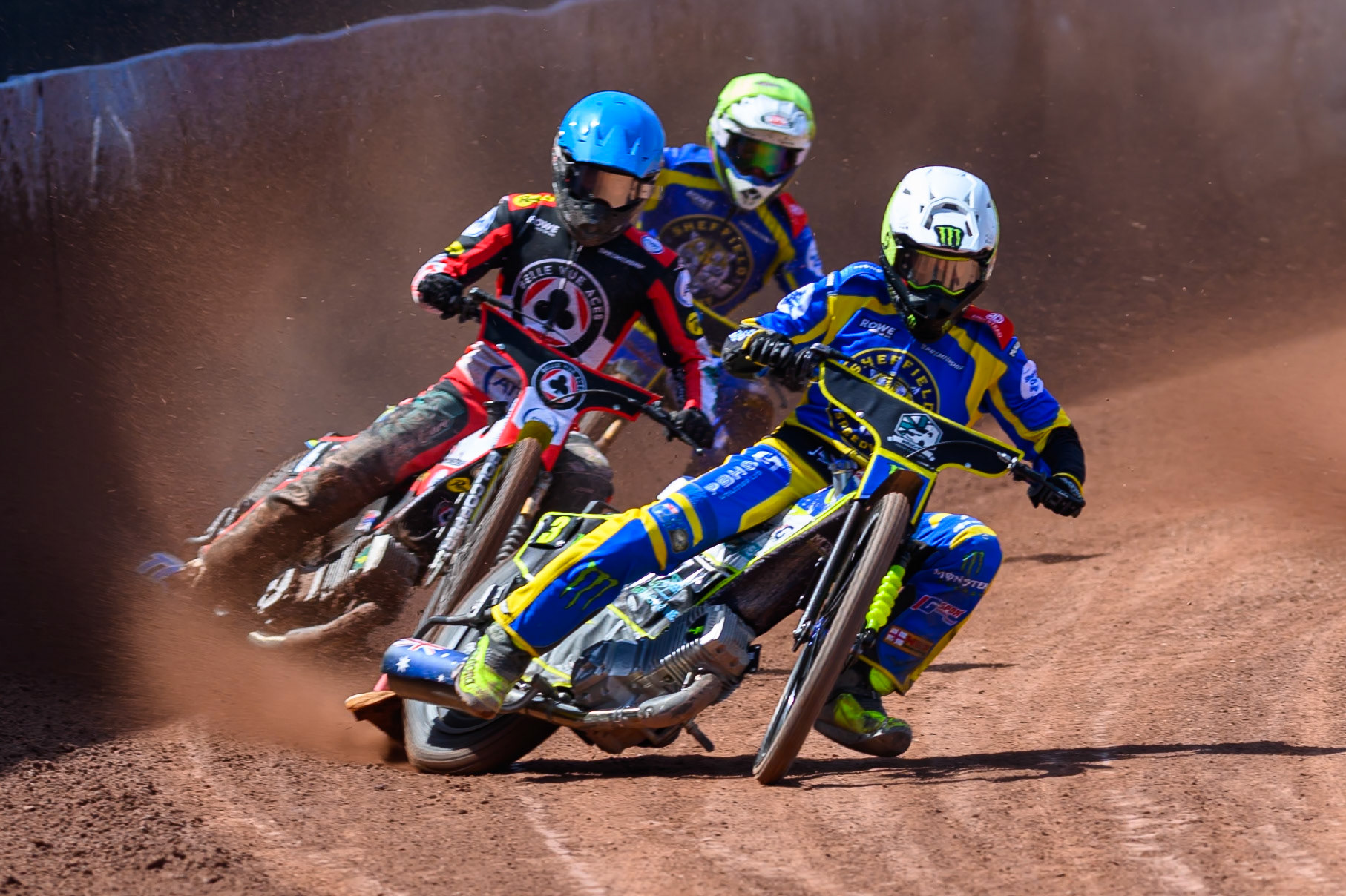 Chris Holder of Sheffield Tigers in White leading Tate Zischke of Belle Vue Aces in Blue and Leon Flint of Sheffield Tigers in Yellow during the Rowe Motor Oil Premiership match between Belle Vue Aces and Sheffield Tigers at the National Speedway Stadium, Manchester on Monday 25th May 2026. (Photo: Ian Charles | MI News)