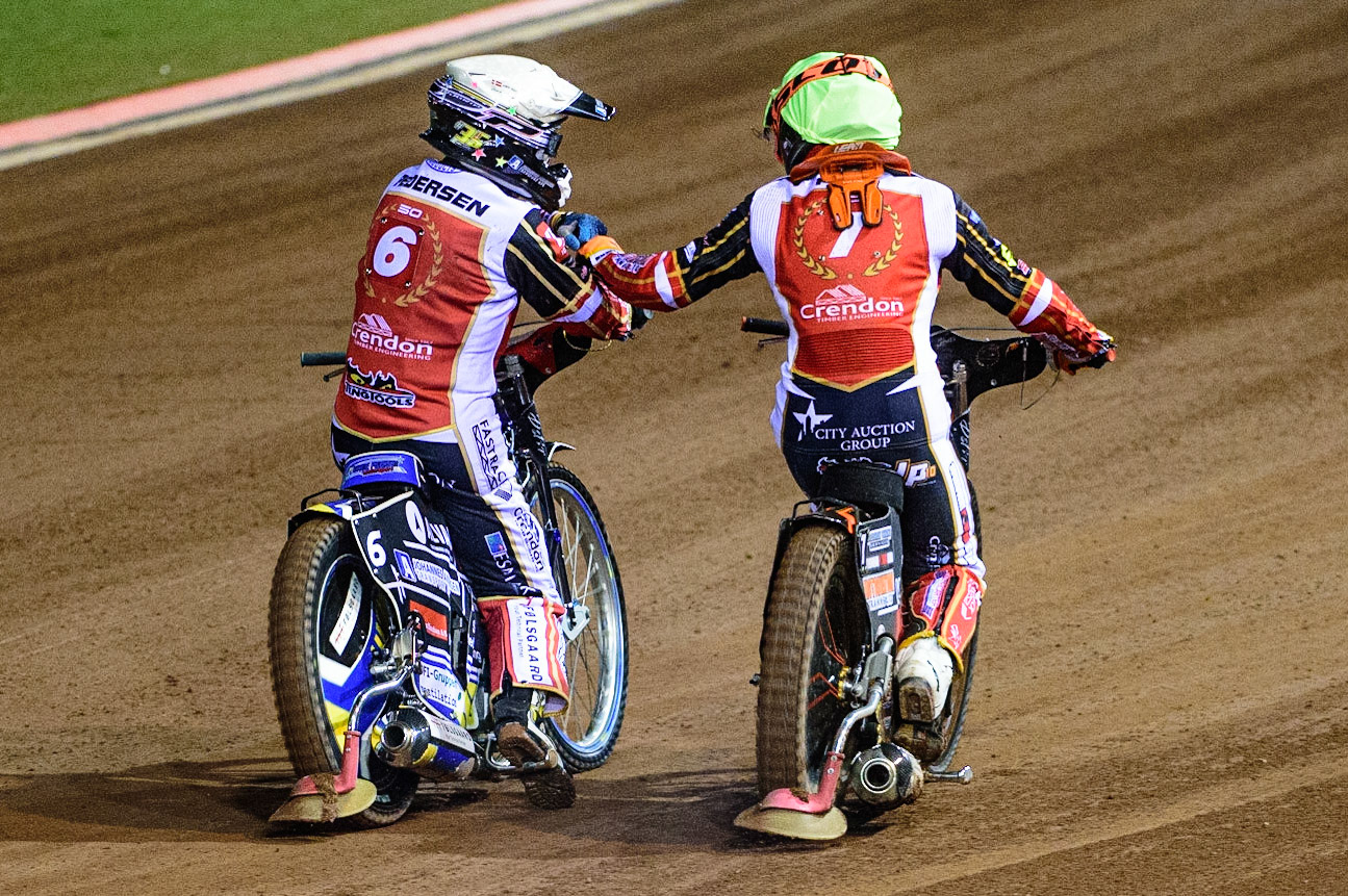MANCHESTER, UK. OCT 11TH  Bjarne Pedersen  (White) and Jordan Palin  (Yellow) celebrate their win during the SGB Premiership Grand Final 1st Leg between Belle Vue Aces and Peterborough Panthers at the National Speedway Stadium, Manchester on Monday 11th October 2021. (Credit: Ian Charles | MI News)