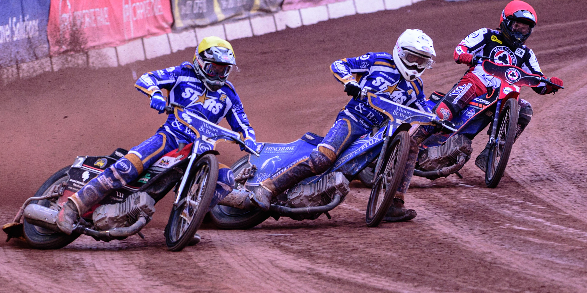 MANCHESTER UK  Richie Worrall  (Yellow) and Lewis Kerr  (White) outside Brady Kurtz  (Red) during the SGB Premiership match between Belle Vue Aces and King's Lynn Stars at the National Speedway Stadium, Manchester on Monday 11th July 2022. (Credit: Ian Charles | MI News)