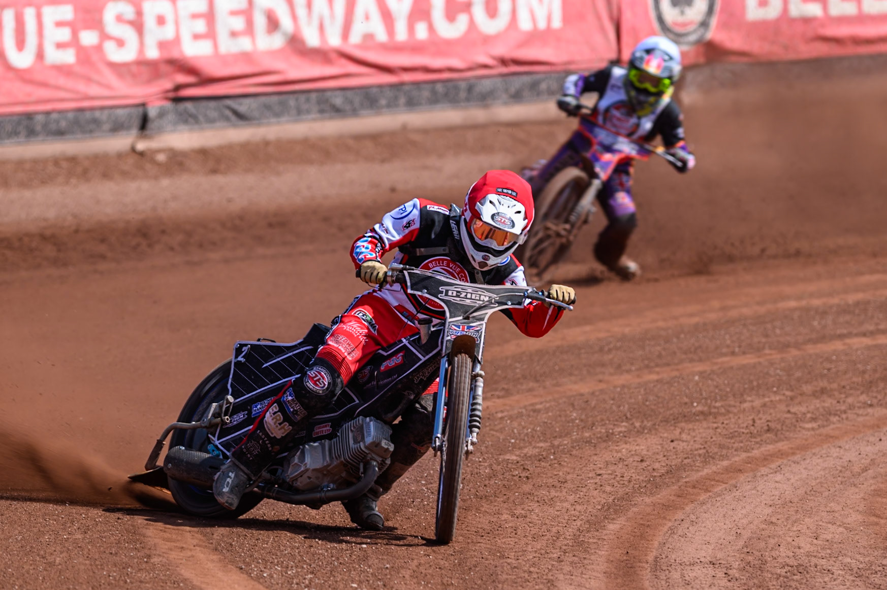 Jack Shimelt of Belle Vue Colts   in Red leading Elliot Kelly of Middlesborough Tigers  in White during the WSRA National Development League match between Belle Vue Colts and Middlesbrough Tigers at the National Speedway Stadium, Manchester on Sunday 10th August 2025. (Photo: Mark Fletcher | MI News)