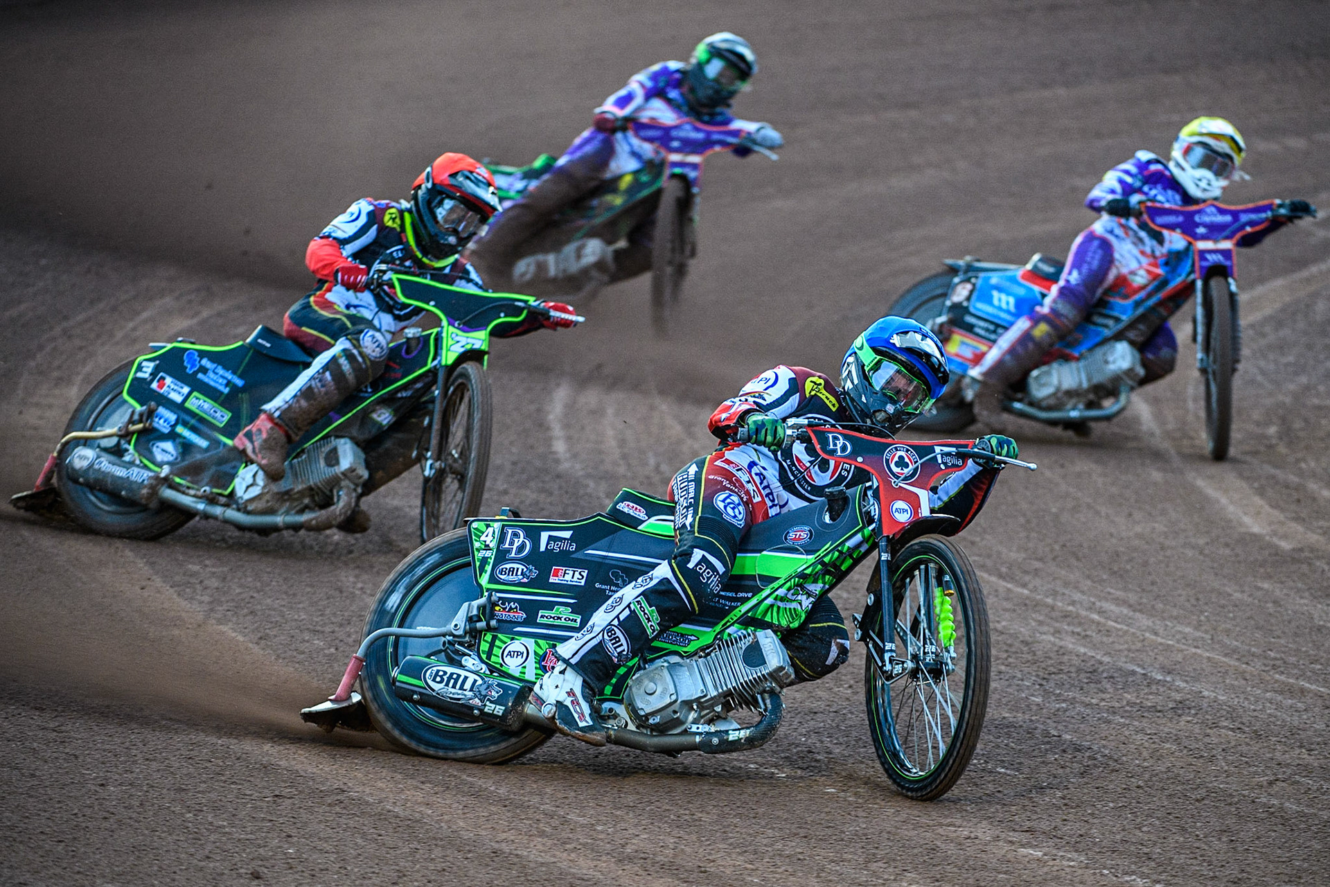 Charles Wright  (Blue) and Tom Brennan  (Red) lead Ben Cook  (Yellow) and Benjamin Basso  (White) during the SGB Premiership match between Belle Vue Aces and Peterborough at the National Speedway Stadium, Manchester on Monday 24th April 2023. (Photo: Ian Charles | MI News)
