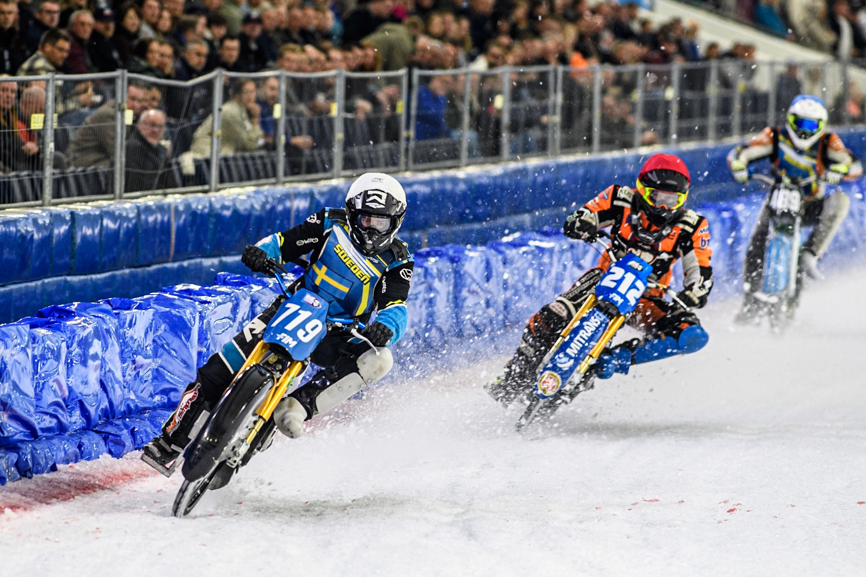 Filip Jäger (719) of Sweden in White leading Lukas Hutla (212) of the Czech Republic in Red and Reserve Melwin Björklin (18) of Sweden in Blue during the FIM Ice Speedway Gladiators World Championship, Final 3 at the Ice Stadium, Thialf, Heerenveen on Saturday 5th April 2025. (Photo: Ian Charles | MI News)