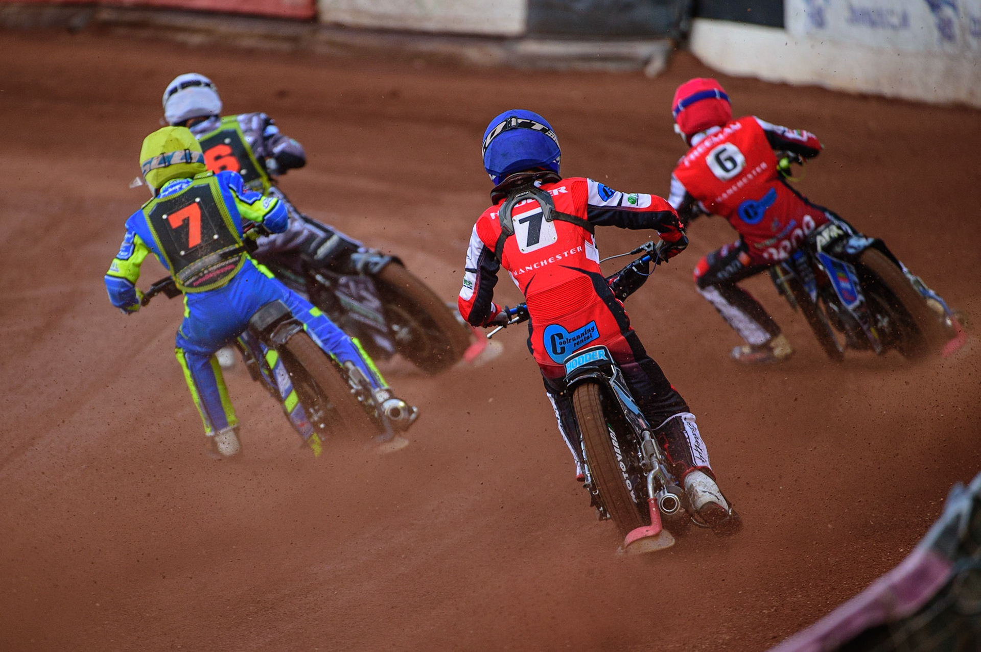 Freddy Hodder  (Blue) chases Luke Muff  (Yellow) Josh Warren  (White) and Archie Freeman  (Red) during the National Development League match between Belle Vue Colts and Mildenhall Fens Tigers at the National Speedway Stadium, Manchester on Friday 15th July 2022. (Credit: Ian Charles | MI News)
