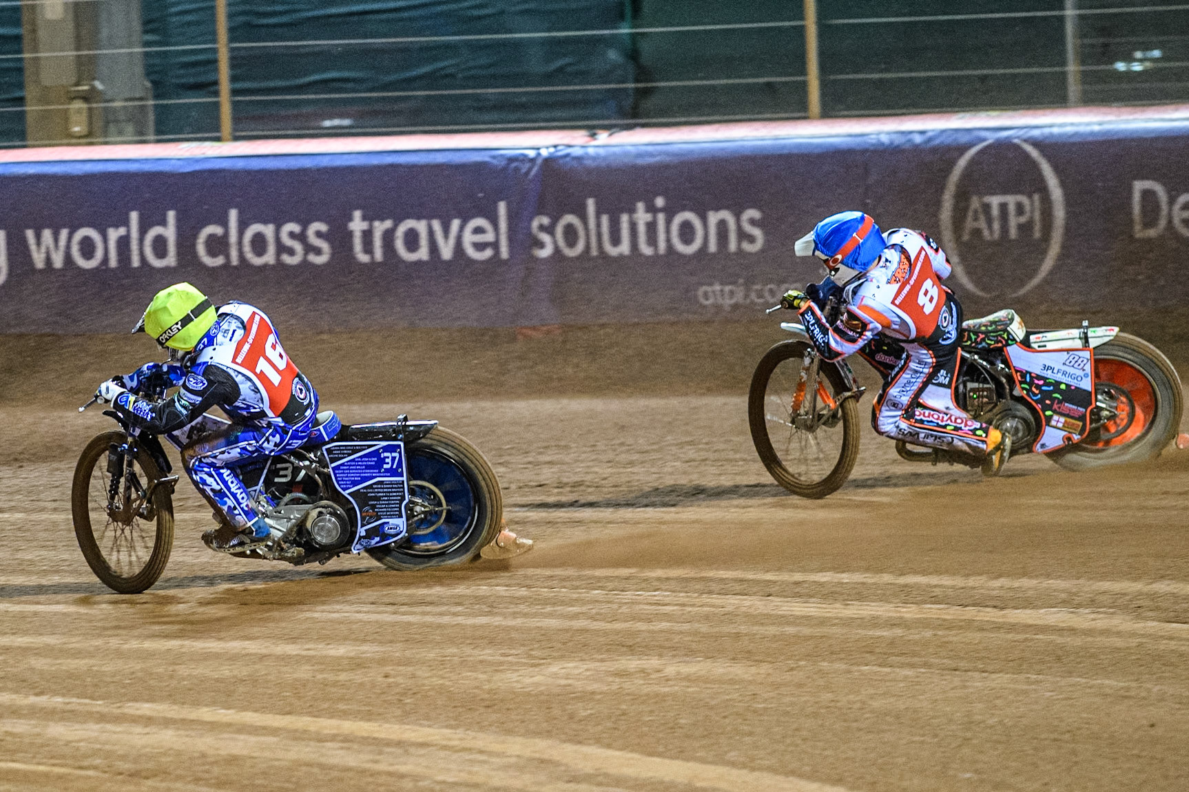 Denmark's Niels-Kristian Iversen (Blue) chases England's Chris Harris (Yellow) during the Peter Craven Memorial Trophy meeting at the National Speedway Stadium, Manchester on Monday 18th March 2024. (Photo: Ian Charles | MI News)