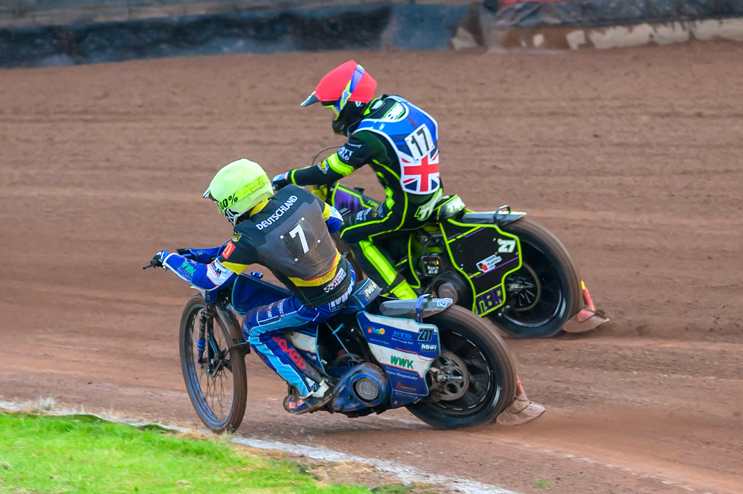 Mario Hausl of Germany in Yellow rides inside Reserve Tom Brennan of Great Britain in Red during the Speedway GP Qualifying Round 3 at Allied Ashfield Stadium, Glasgow on Saturday 30th May 2026. (Photo: Ian Charles | MI News)