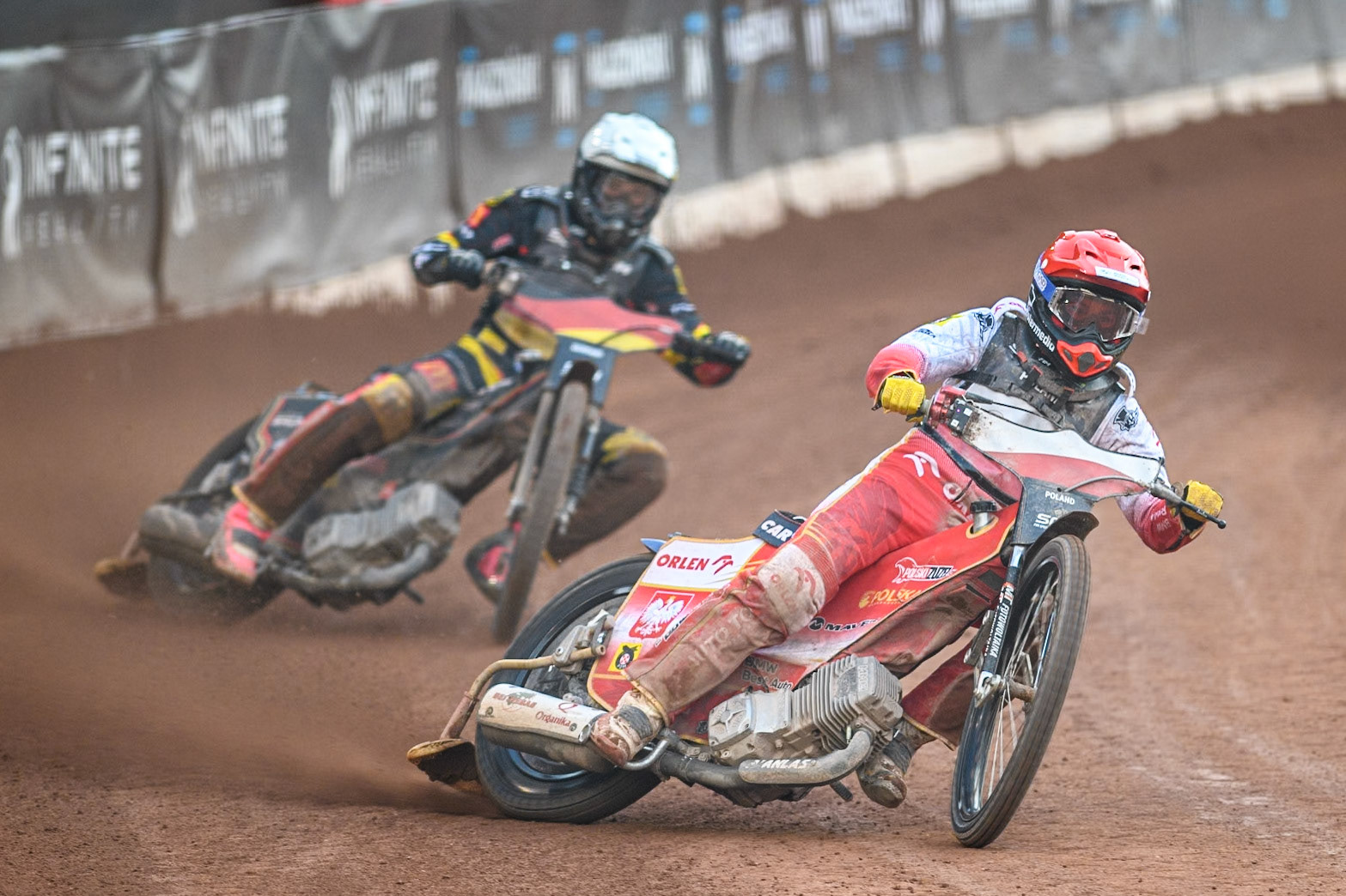 POLAND v GERMANY: Dominik Kubera of Poland in Red leading Kai Huckenbeck of Germany in White during the Monster Energy FIM Speedway of Nation Final at the National Speedway Stadium, Manchester on Saturday 13th July 2024. (Photo: Ian Charles | MI News)