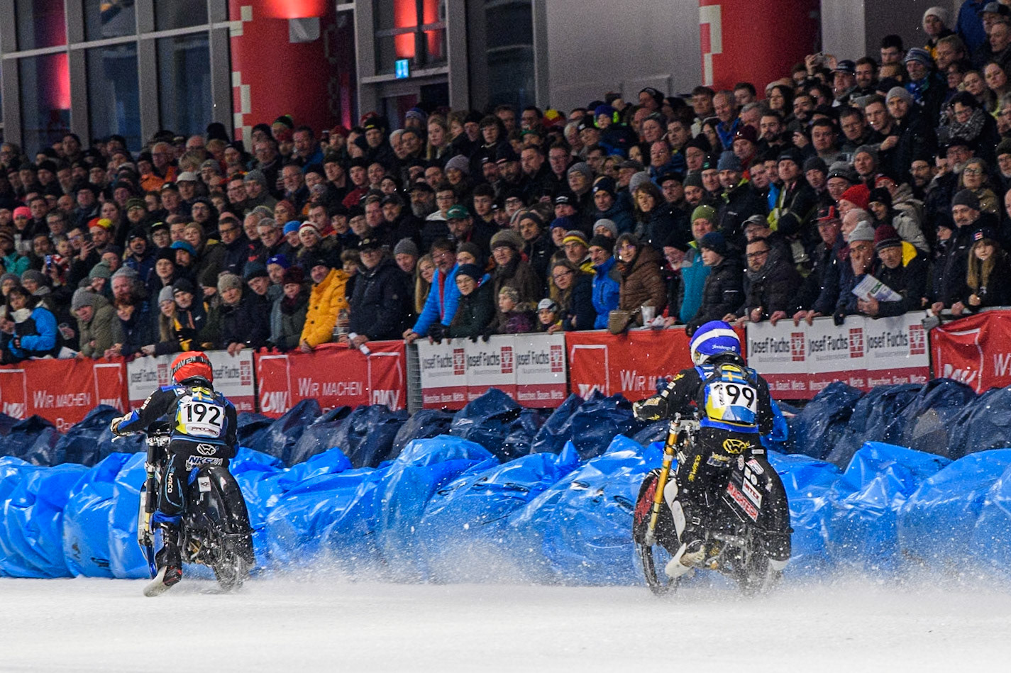 Martin Haarahiltunen (199) of Sweden in Blue chases Niclas Svensson (192) of Sweden in Red during the Ice Speedway Gladiators World Championship Final 1 at Max-Aicher-Arena, Inzell on Saturday 15th March 2025. (Photo: Ian Charles | MI News)