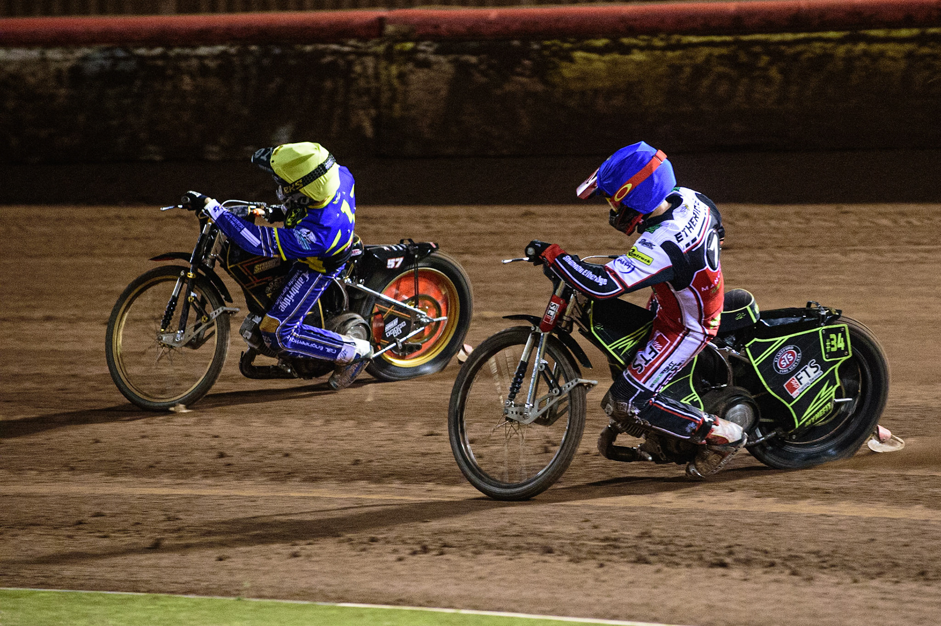 MANCHESTER, UK. OCT 7TH  Jye Etheridge (Blue) chases Danyon Hume  (Yellow) during the SGB Premiership Play off Semi-Final Second Leg between Belle Vue Aces and Sheffield Tigers at the National Speedway Stadium, Manchester on Thursday 7th October 2021. (Credit: Ian Charles | MI News)