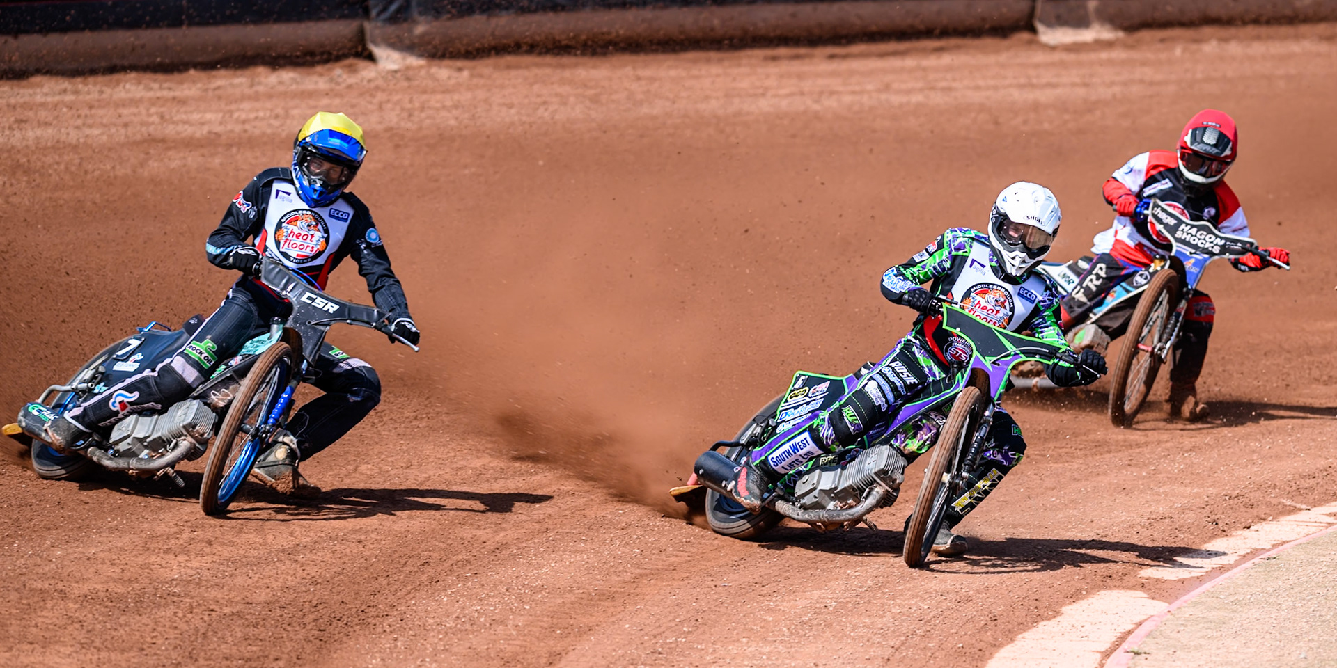 Kai Ward of Middlesborough Tigers  in White and Charlie Southwick of Middlesborough Tigers  in Yellow leading Harry Fletcher of Belle Vue Colts  in Red during the WSRA National Development League match between Belle Vue Colts and Middlesbrough Tigers at the National Speedway Stadium, Manchester on Sunday 10th August 2025. (Photo: Mark Fletcher | MI News)