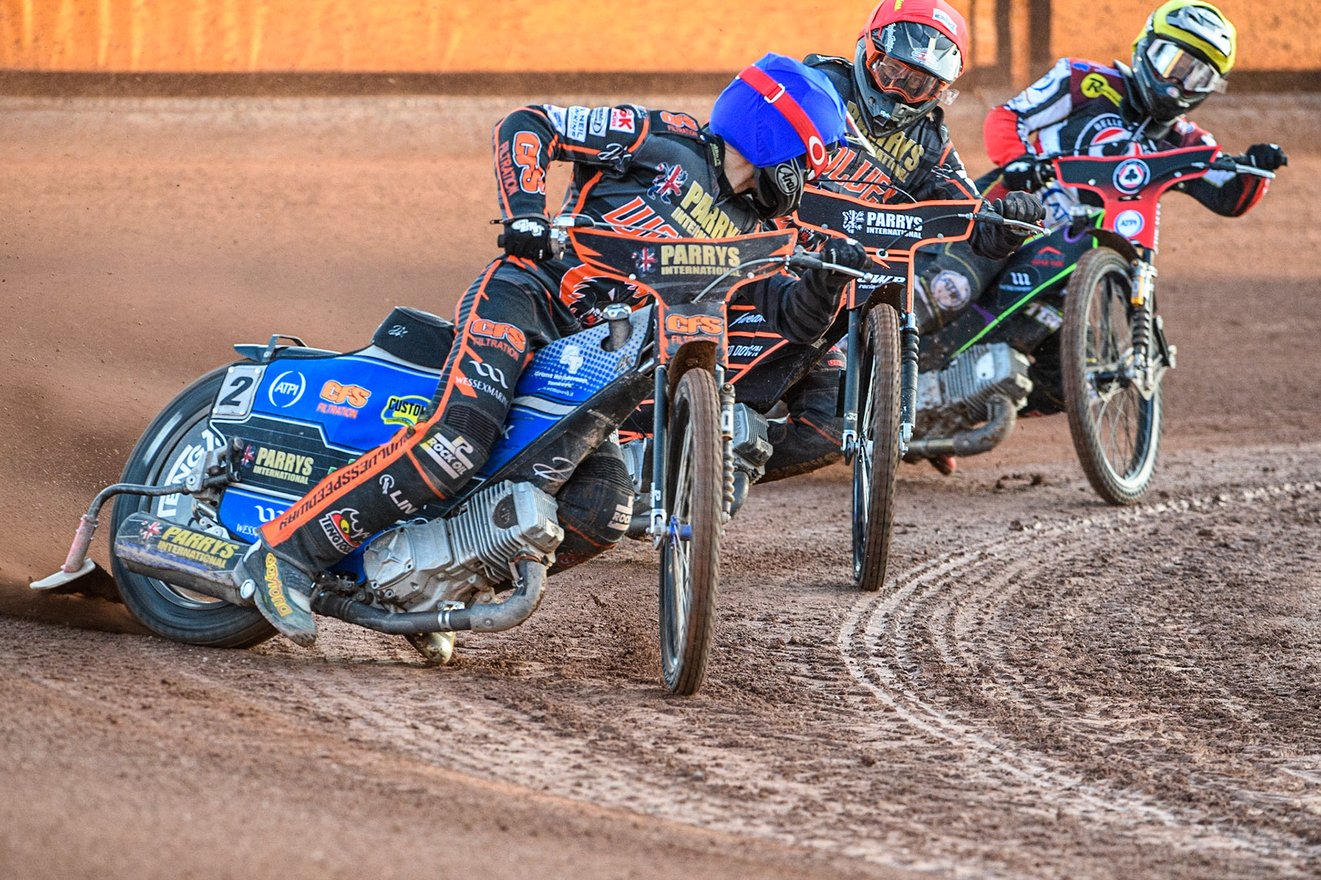 Steve Worrall (Blue) looks for his team mate Sam Masters (Red) as they lead Tom Brennan (Yellow)  during the Sports Insure Premiership match between Wolverhampton Wolves and Belle Vue Aces at Monmore Green Stadium, Wolverhampton on Monday 29th May 2023. (Photo: Ian Charles | MI News)