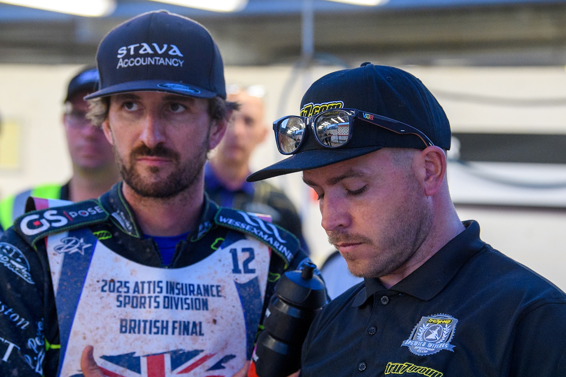 Adam Ellis (Left) with Ipswich Team Manager Richie Hawkins during the Attis Insurance Sports Division British Final at the National Speedway Stadium, Manchester on Monday 12th May 2025. (Photo: Ian Charles | MI News)