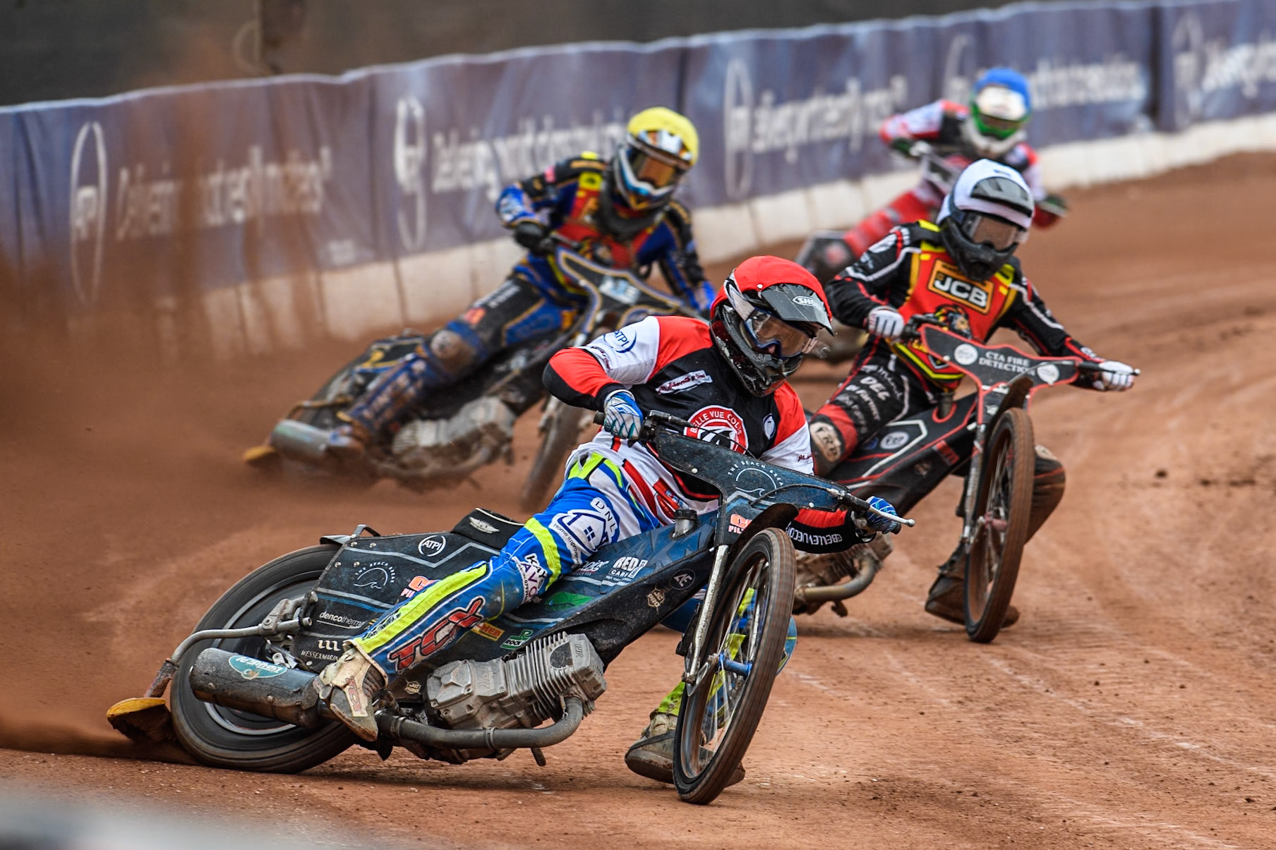 Belle Vue Colts' Jack Kingston  in Red leading Leicester Lion Cubs' Guest Rider Ben Morley in White, Leicester Lion Cubs' Eli Meadows  in Yellow and Belle Vue Colts' Jack Shimelt  in Blue during the WSRA National Development League match between Belle Vue Colts and Leicester Lion Cubs at the National Speedway Stadium, Manchester on Friday 18th April 2025. (Photo: Ian Charles | MI News)
