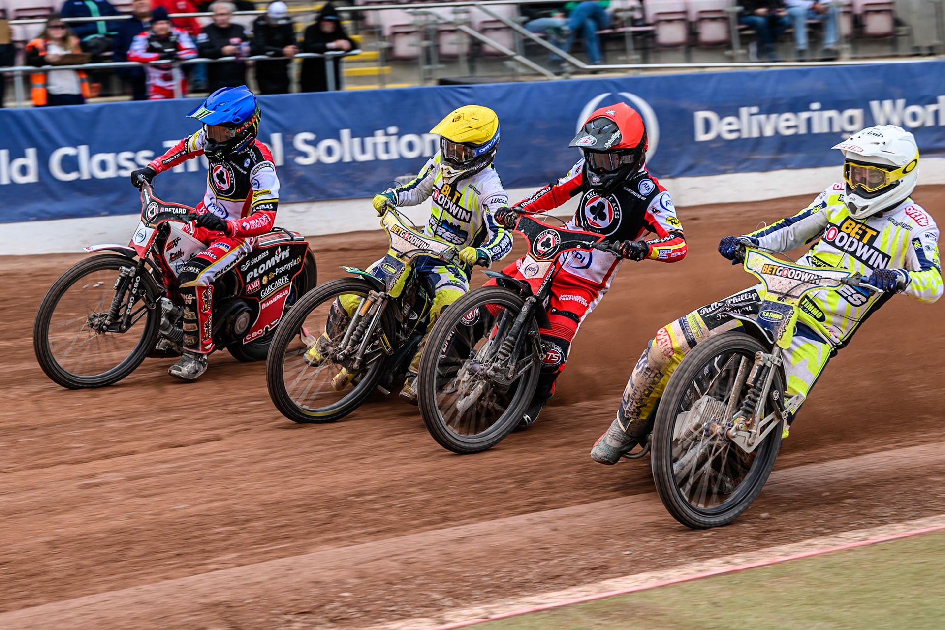(L to R) Belle Vue Aces' Dan Bewley in Blue, Oxford Spires' Rohan Tungate in Yellow, Belle Vue Aces' Zach Cook in Red and Oxford Spires' Peter Kildemand in White during the Rowe Motor Oil Premiership match between Belle Vue Aces and Oxford Spires at the National Speedway Stadium, Manchester on Monday 26th May 2025. (Photo: Ian Charles | MI News)