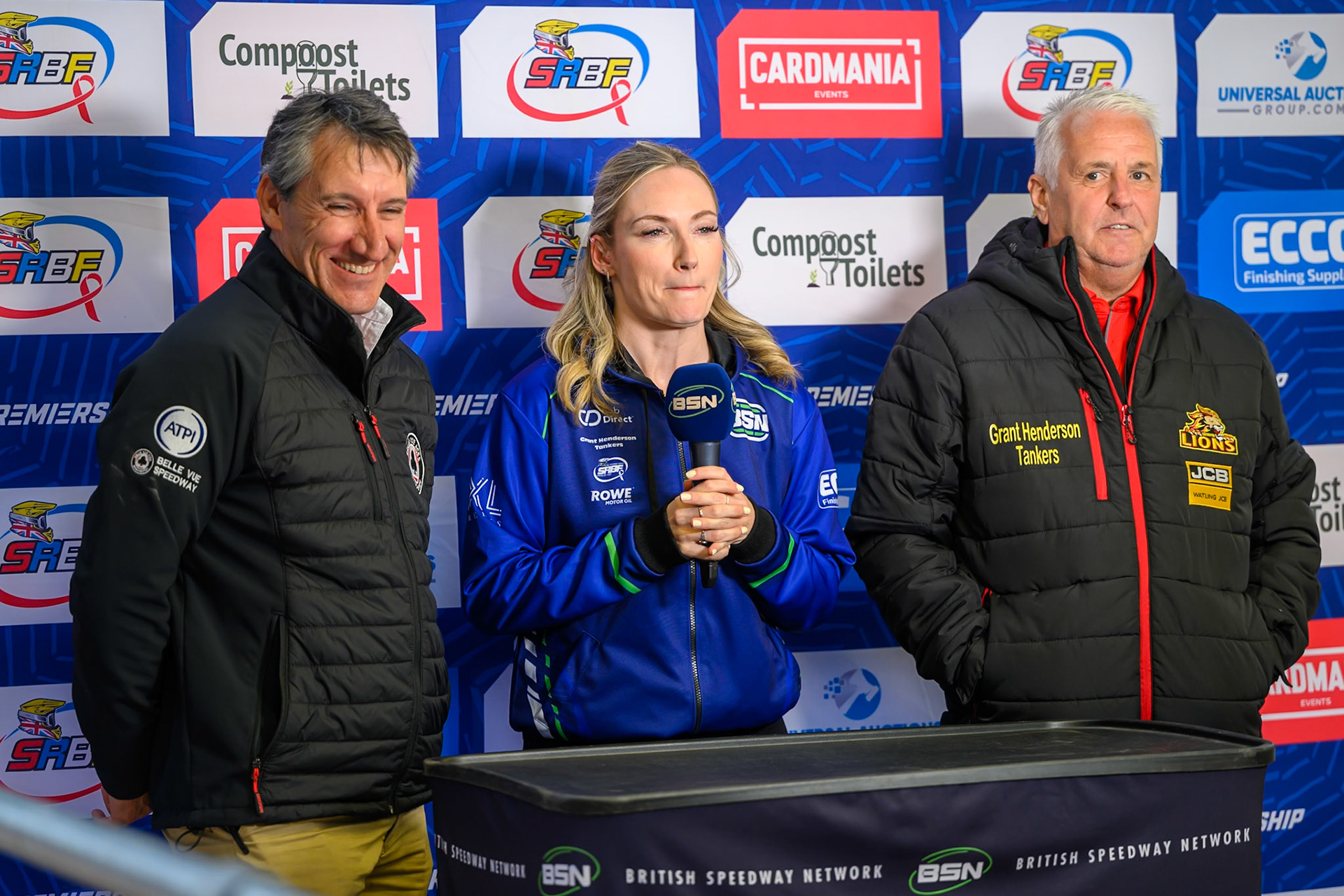 (L to R) Mark Lemon, Team Manager of Belle Vue Aces , Laura Pollard from BSN and Stewart Dickson, Team Manager of Leicester Lions in the pre meeting interview during the Rowe Motor Oil Premiership match between Belle Vue Aces and Leicester Lions at the National Speedway Stadium, Manchester on Monday 15th June 2026. (Photo: Ian Charles | MI News)