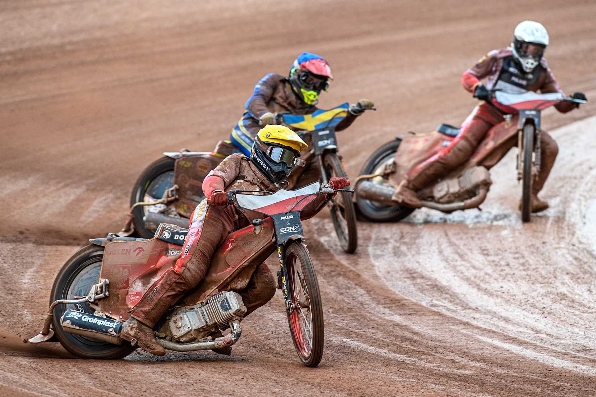 Bartosz Banbor of Poland in Yellow leading Casper Henriksson of Sweden in Blue and Wiktor Przyjemski of Poland in White during the Monster Energy FIM Speedway of Nations 2 (Under 21) Final at the National Speedway Stadium, Manchester on Friday 12th July 2024. (Photo: Ian Charles | MI News)