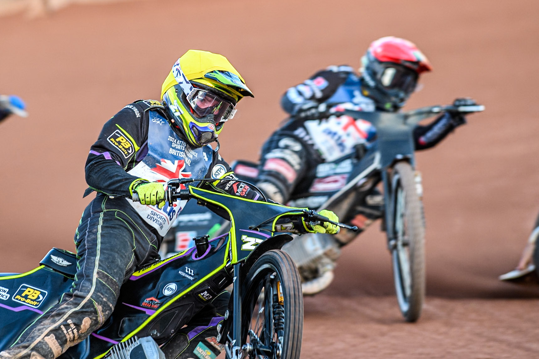 Tom Brennan in Yellow leading Tai Woffinden in Red during the Attis Insurance Sports Division British Speedway Championship Final at the National Speedway Stadium, Manchester on Saturday 8th June 2024. (Photo: Ian Charles | MI News)