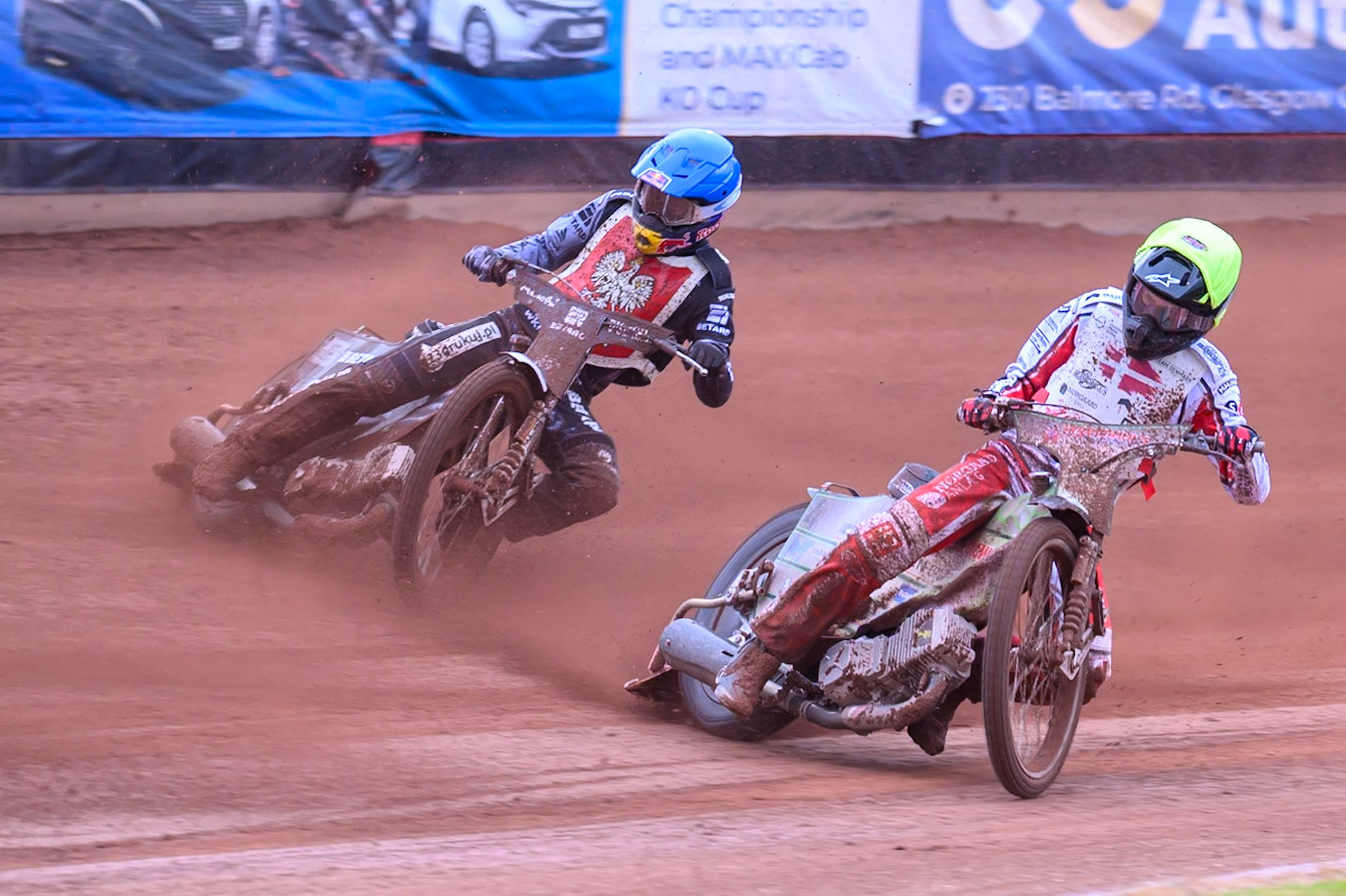 Jonas Knudsen of Denmark in Yellow rides inside Maciej Janowski of Poland in Blue during the Speedway GP Qualifying Round 3 at Allied Ashfield Stadium, Glasgow on Saturday 30th May 2026. (Photo: Ian Charles | MI News)
