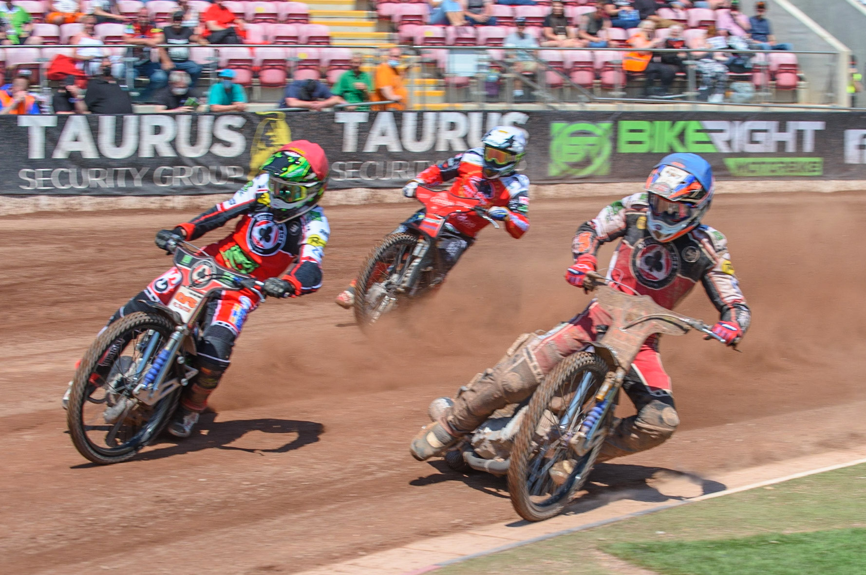 MANCHESTER, UK. MAY 31ST  Dan Bewley  (Red) and Steve Worrall  lead Chris Harris  (White) in the rerun of Heat9 during the SGB Premiership match between Belle Vue Aces and Peterborough at the National Speedway Stadium, Manchester on Monday 31st May 2021. (Credit: Ian Charles | MI News)