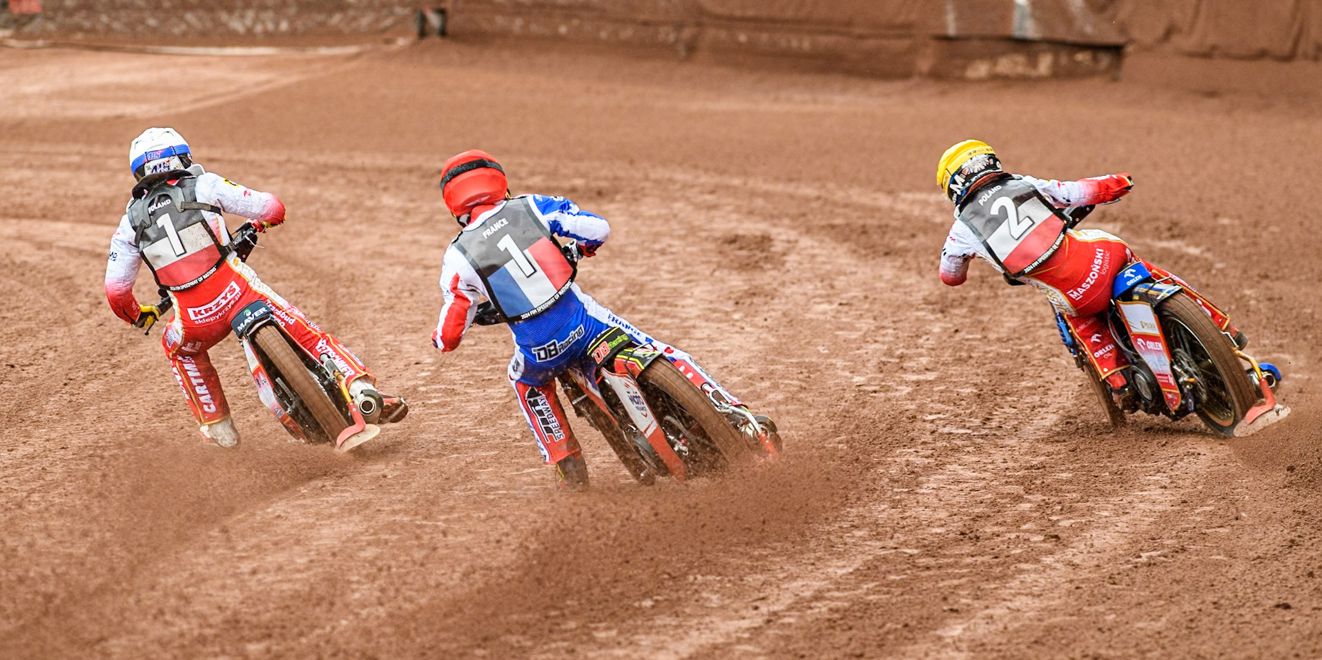 David Bellego of France in Red chases Dominik Kubera of Poland in White and Bartosz Zmarzlik of Poland in Yellow during the Monster Energy FIM Speedway of Nations Semi-Final 1 at the National Speedway Stadium, Manchester on Tuesday 9th July 2024. (Photo: Ian Charles | MI News)