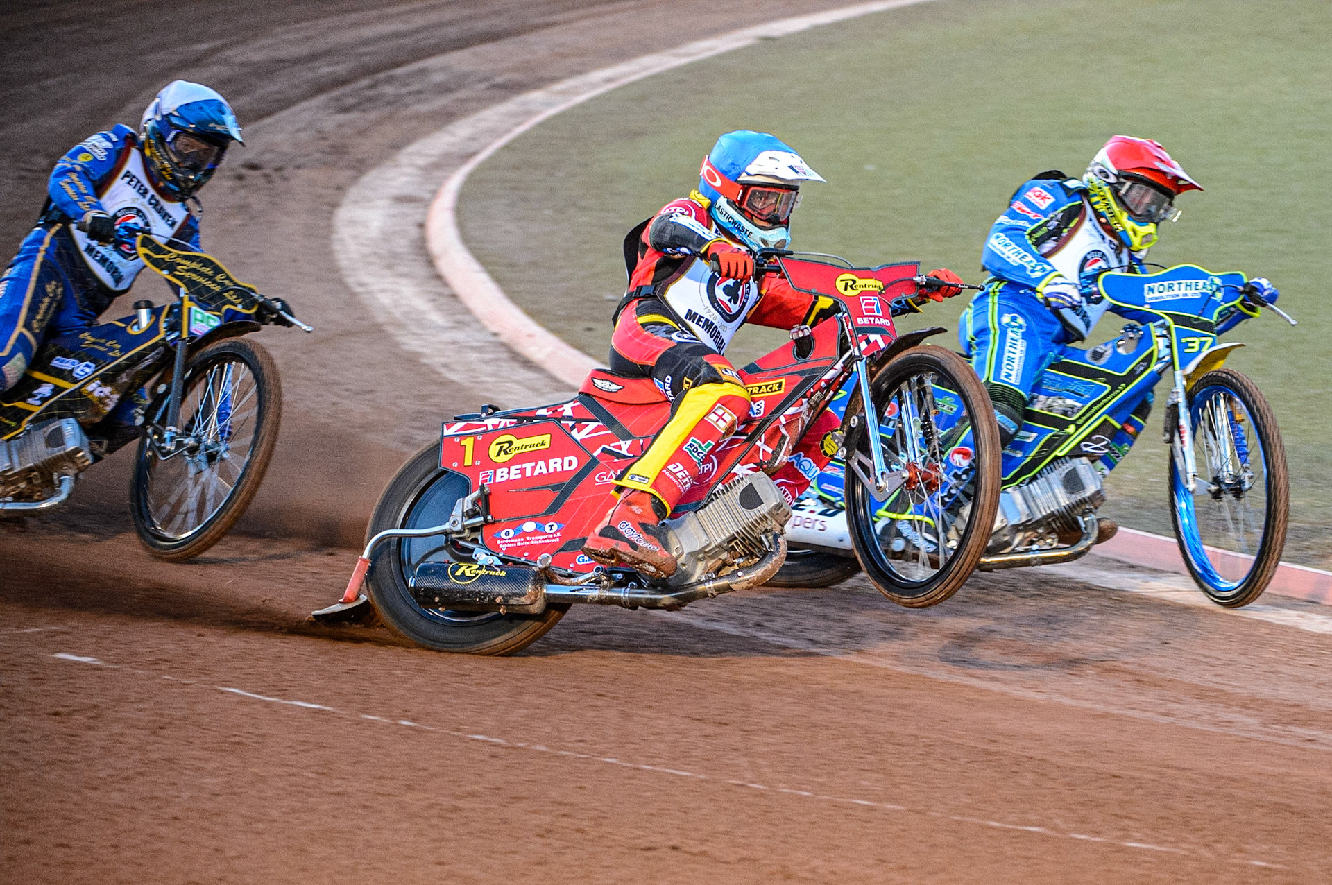Max Fricke  (Blue) picks up some drive outside Chris Harris (Red) with Kyle Howarth (White) behind during the Peter Craven Memorial Trophy  at the National Speedway Stadium, Manchester on Monday 3rd April 2023. (Photo: Ian Charles | MI News)