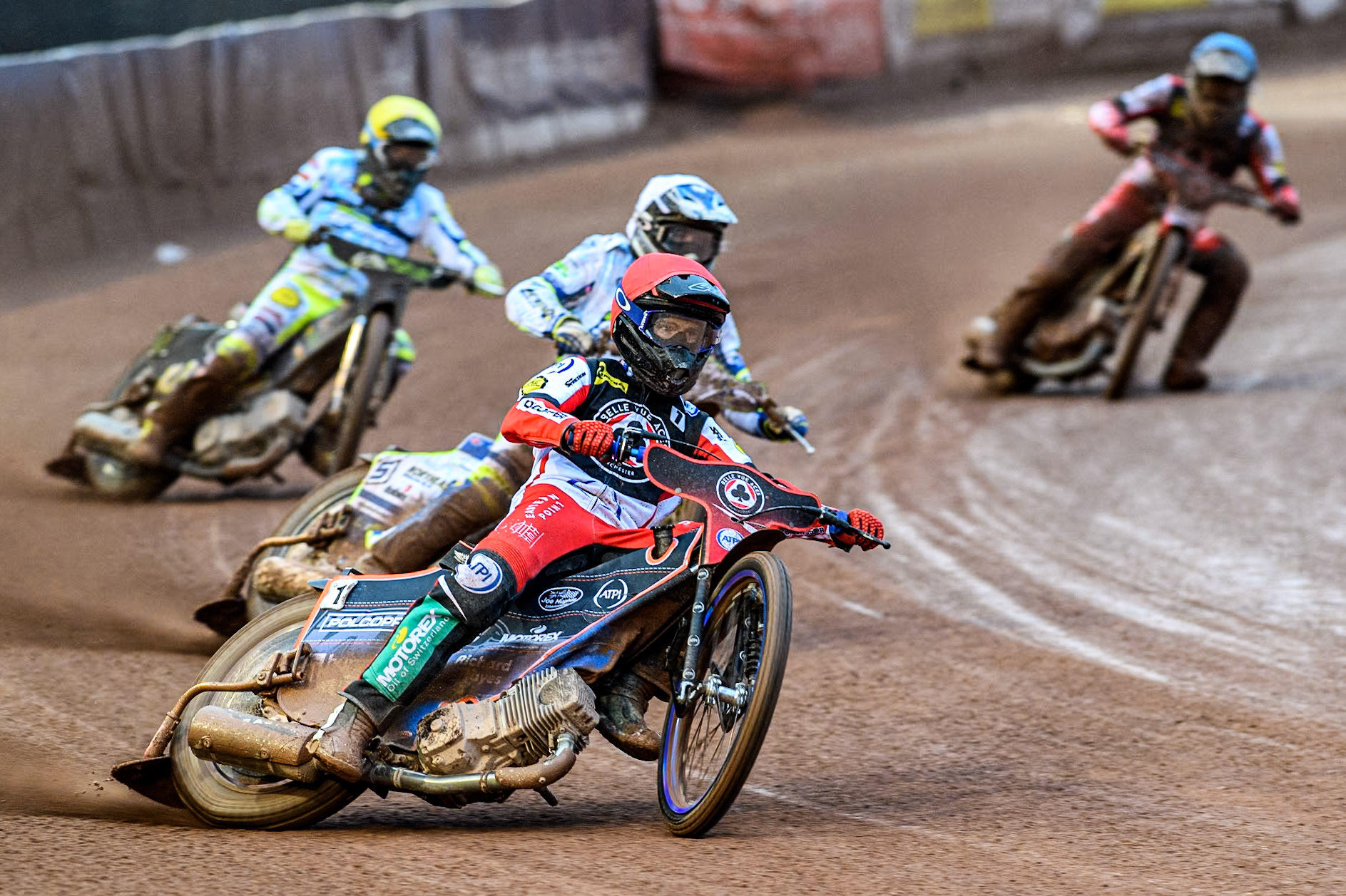 Belle Vue Aces' Brady Kurtz in Red leading Oxford Spires' Chris Harris in White. Oxford Spires' Craig Cook in Yellow and Belle Vue Aces' Norick Blodorn in Blue during the Rowe Motor Oil Premiership match between Belle Vue Aces and Oxford Spires at the National Speedway Stadium, Manchester on Monday 13th May 2024. (Photo: Ian Charles | MI News)