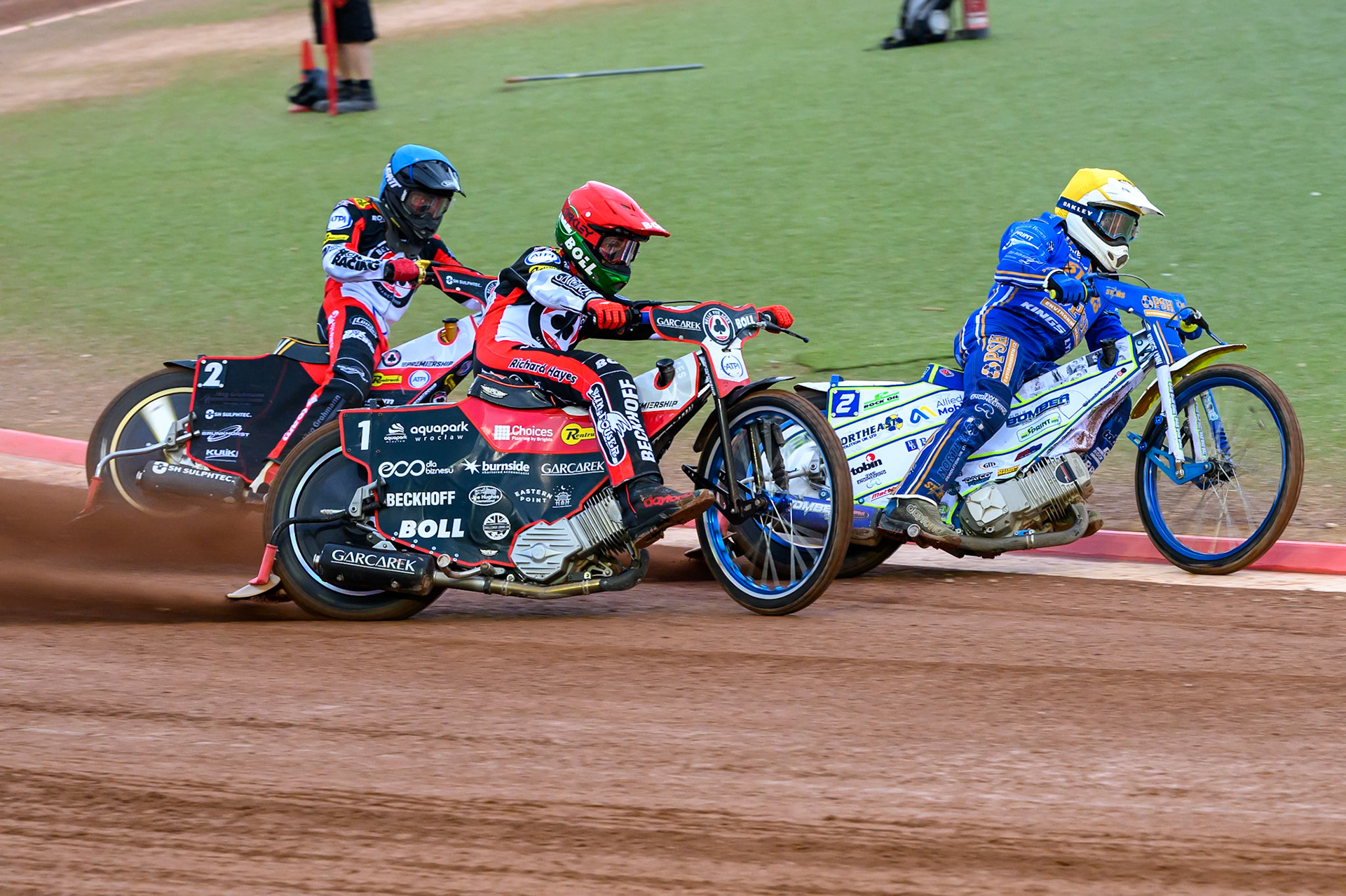 Chris Harris of Kings Lynn Stars in Yellow leading Brady Kurtz of Belle Vue Aces in Red  and Norick Blödorn of Belle Vue Aces in Blue during the Rowe Motor Oil Premiership match between Belle Vue Aces and King's Lynn Stars at the National Speedway Stadium, Manchester on Monday 29th June 2026. (Photo: Ian Charles | MI News)
