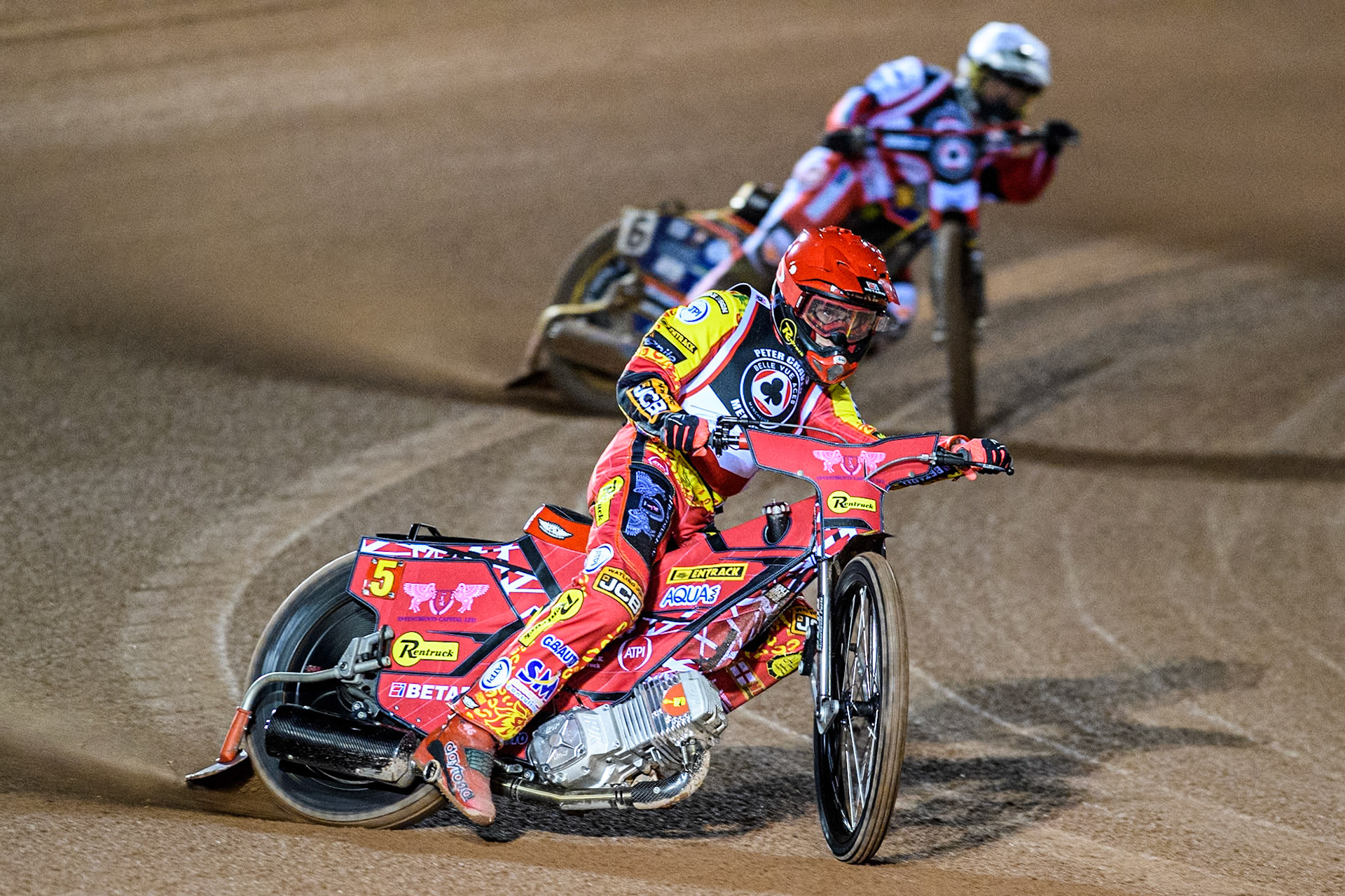Australia's Max Fricke (Red) leads  England's Connor Mountain (White) during the Peter Craven Memorial Trophy meeting at the National Speedway Stadium, Manchester on Monday 18th March 2024. (Photo: Ian Charles | MI News)