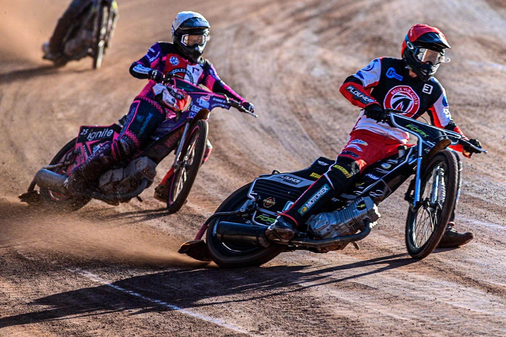 Belle Vue Colts' Matt Marson in Red leading Middlesbrough Tigers' Ben Trigger in White during the WSRA National Development League match between Belle Vue Colts and Middlesbrough Tigers at the National Speedway Stadium, Manchester on Monday 17th June 2024. (Photo: Ian Charles | MI News)