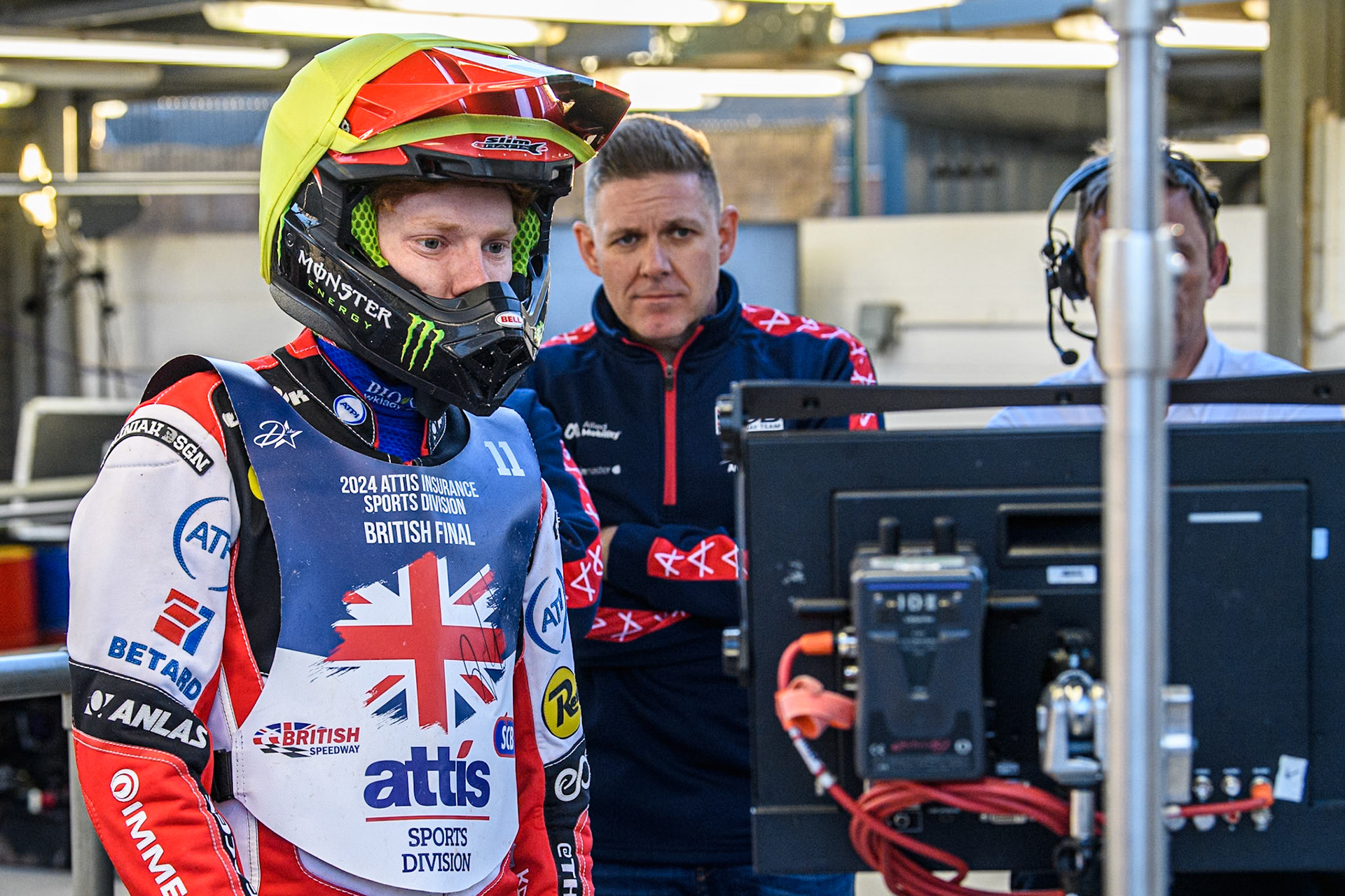 Dan Bewley (Left) watches the monitor showing the racing during the Attis Insurance Sports Division British Speedway Championship Final at the National Speedway Stadium, Manchester on Saturday 8th June 2024. (Photo: Ian Charles | MI News)