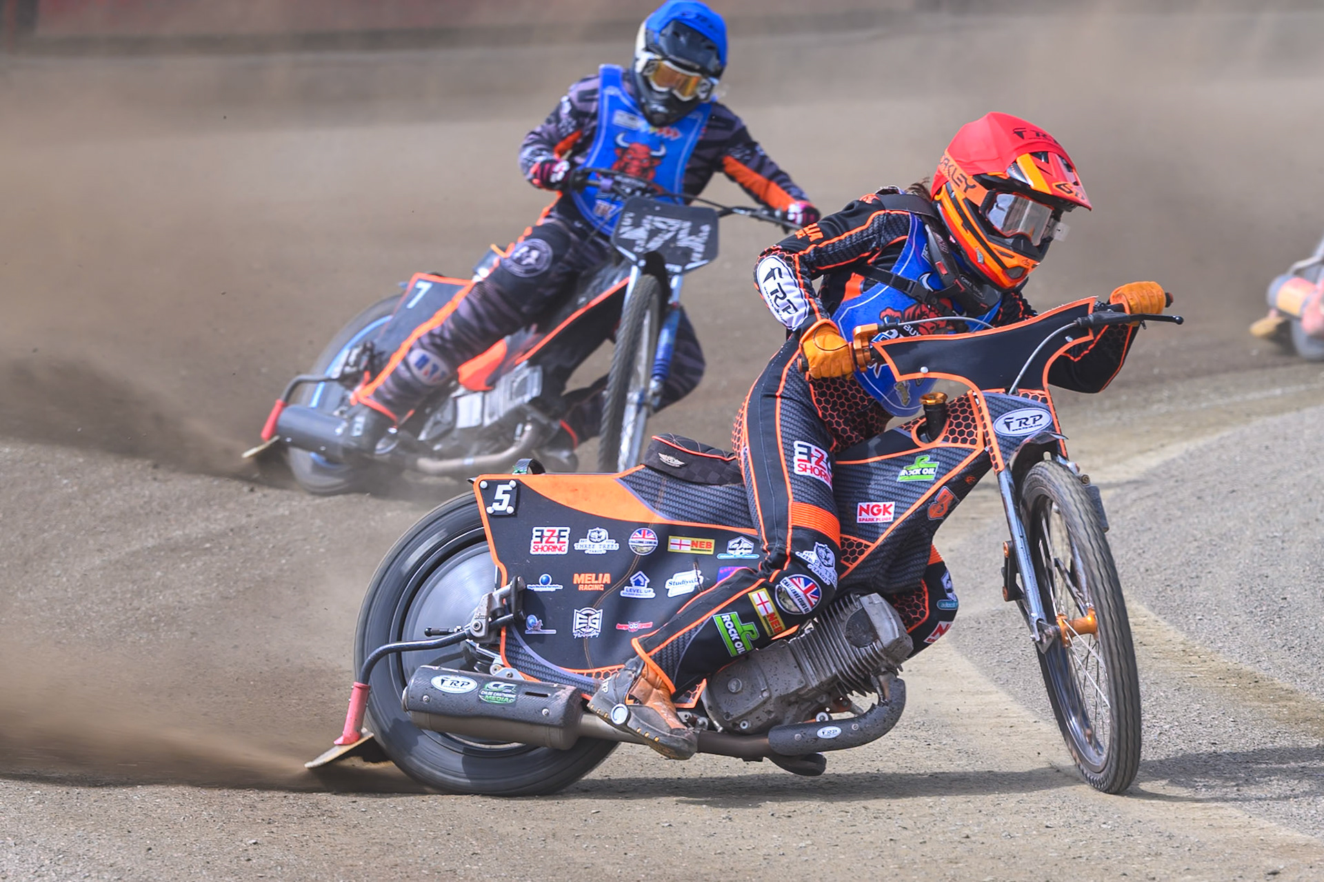 Jack Smith of Buxton Bulls in Red leading Jack Roberts of Buxton Bulls in Blue during the WSRA National Development League match between Buxton Bulls and Edinburgh Monarchs Academy at Hi-Edge Speedway, Buxton on Sunday 14th June 2026. (Photo: Ian Charles | MI News)
