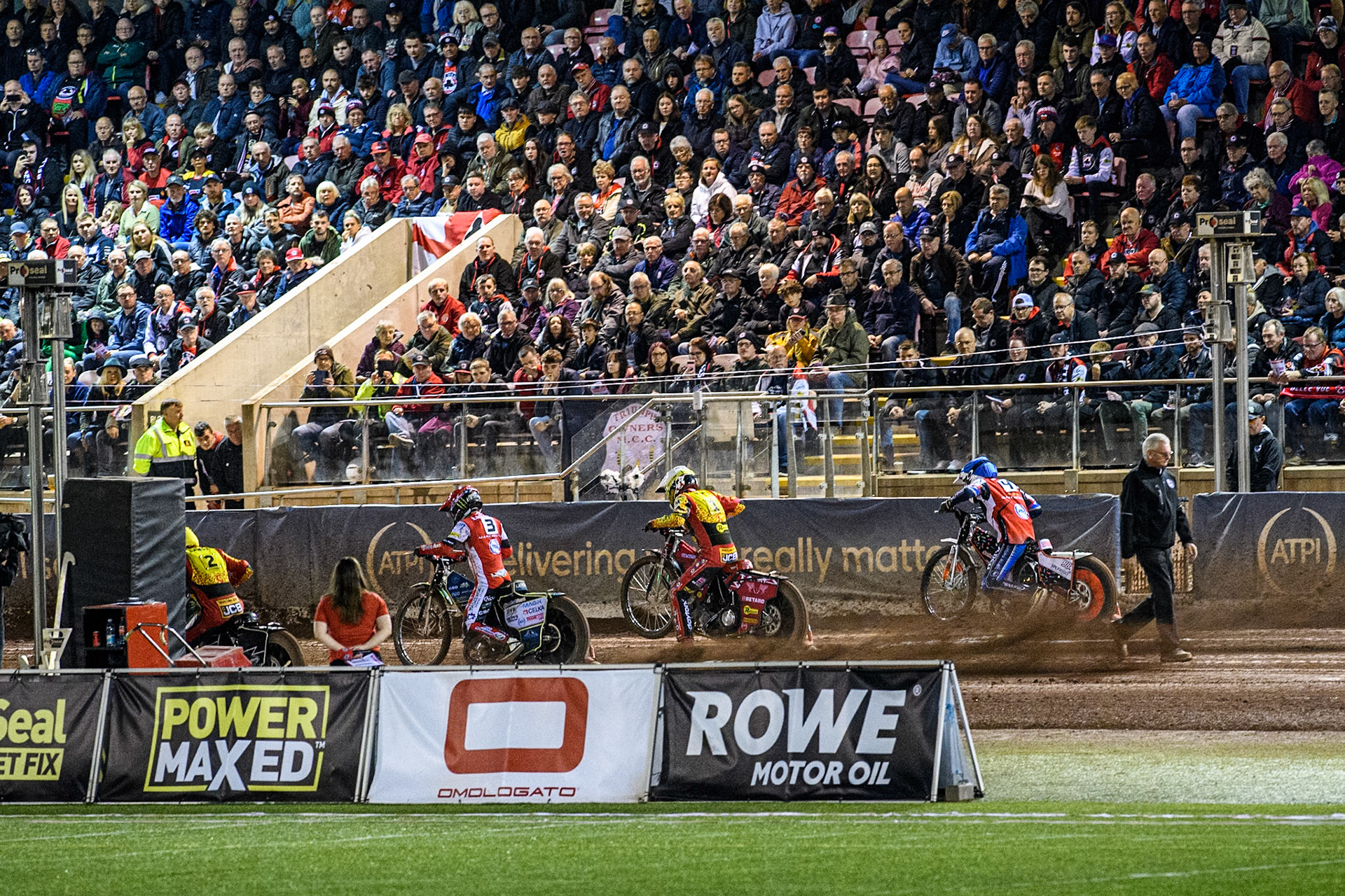 A full grandstand watches the start of Heat 5 during the Rowe Motor Oil Premiership Grand Final 1st Leg between Belle Vue Aces and Leicester Lions at the National Speedway Stadium, Manchester on Monday 23rd September 2024. (Photo: Ian Charles | MI News)
